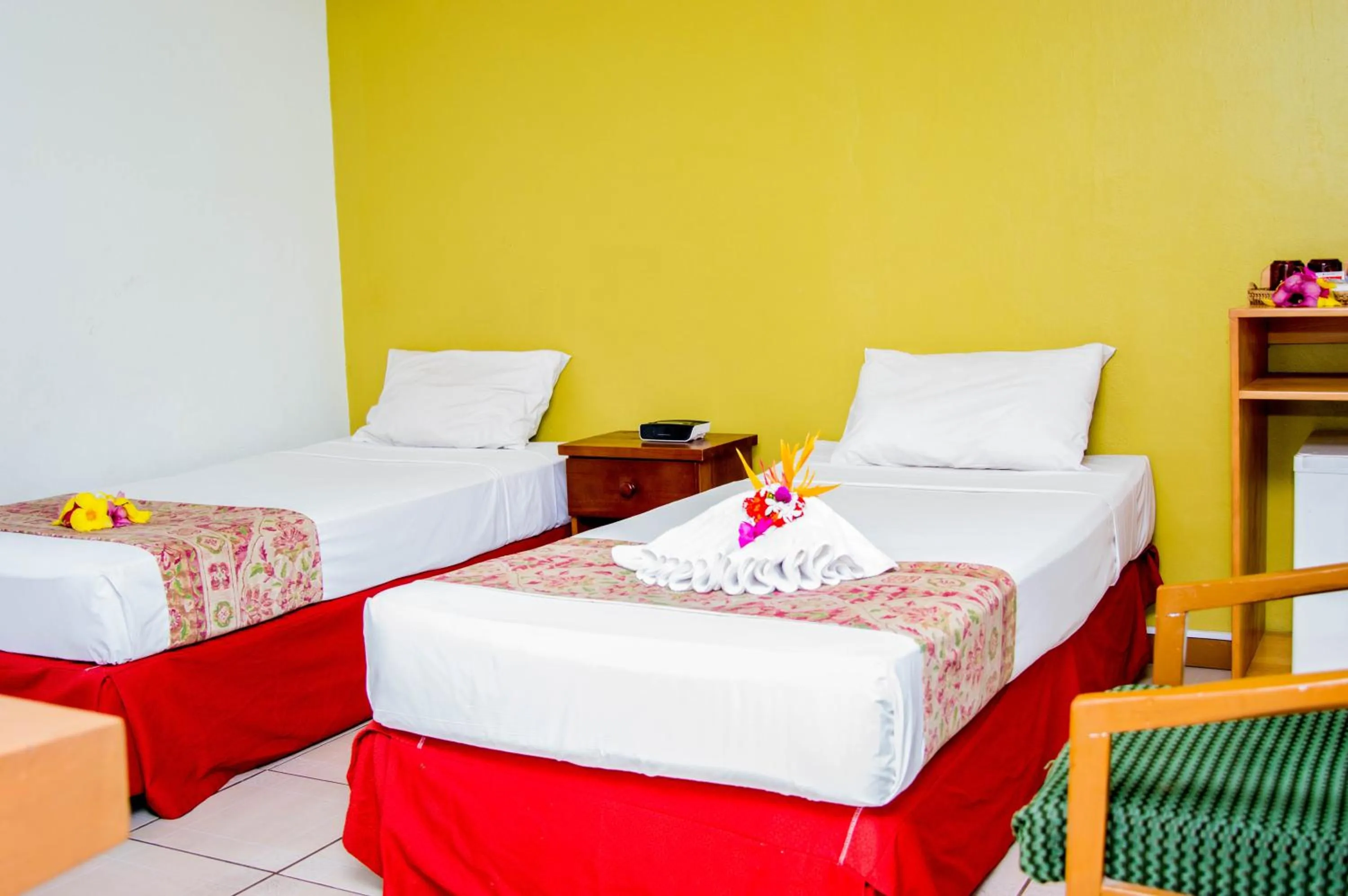 Bed in Hexagon International Hotel, Villas & Spa