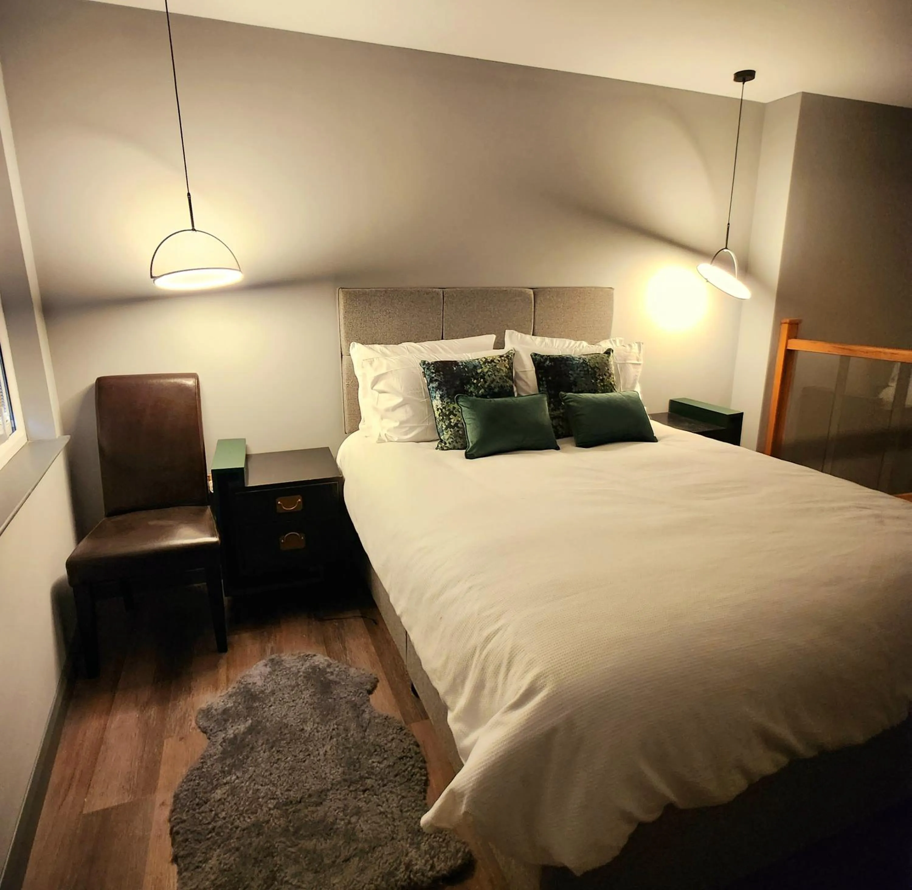 Bed in Pinnacle Suites Hotel