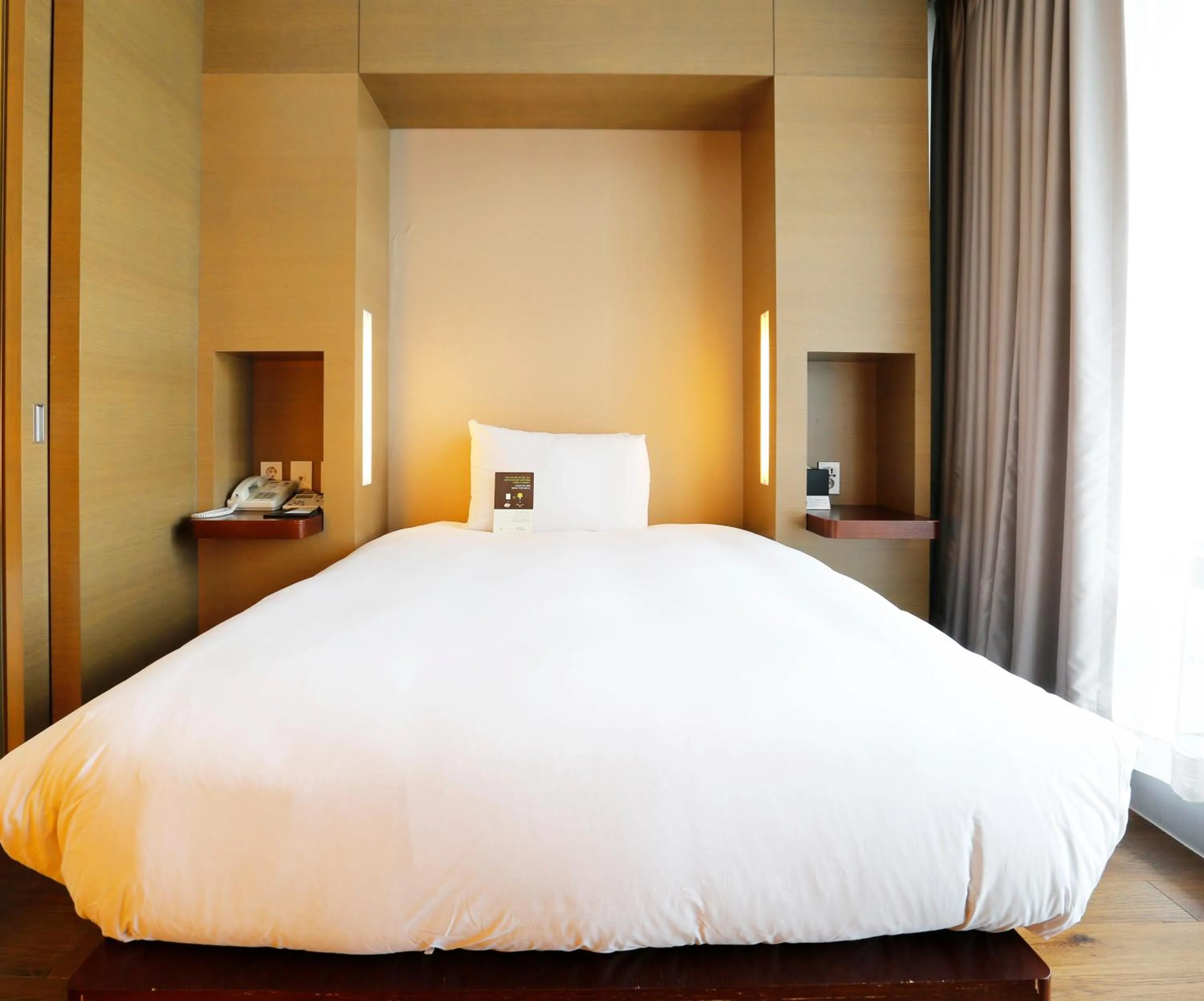 Bed in Grand Mercure Ambassador Changwon