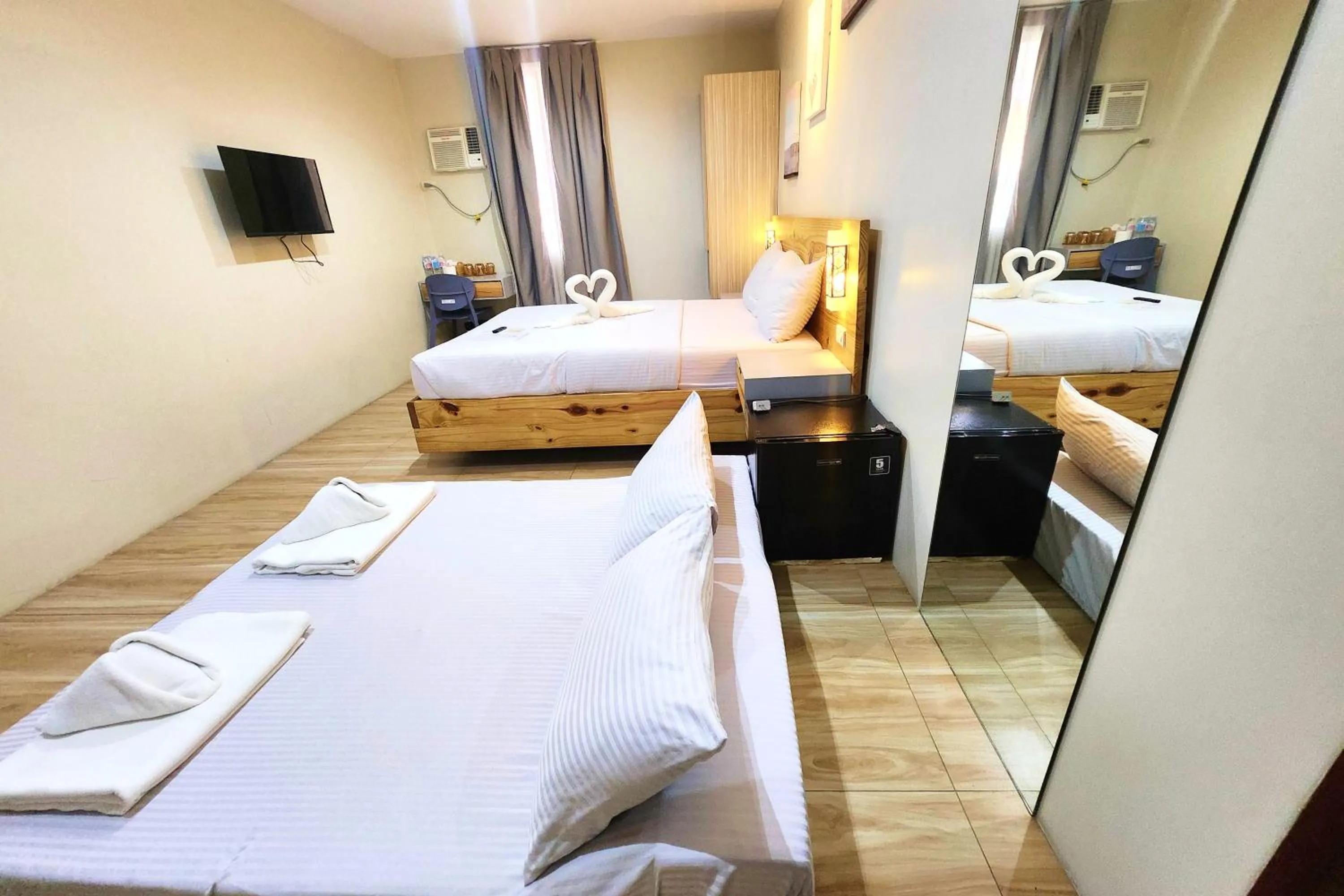 Bed in DLT Suites Cebu powered by Cocotel