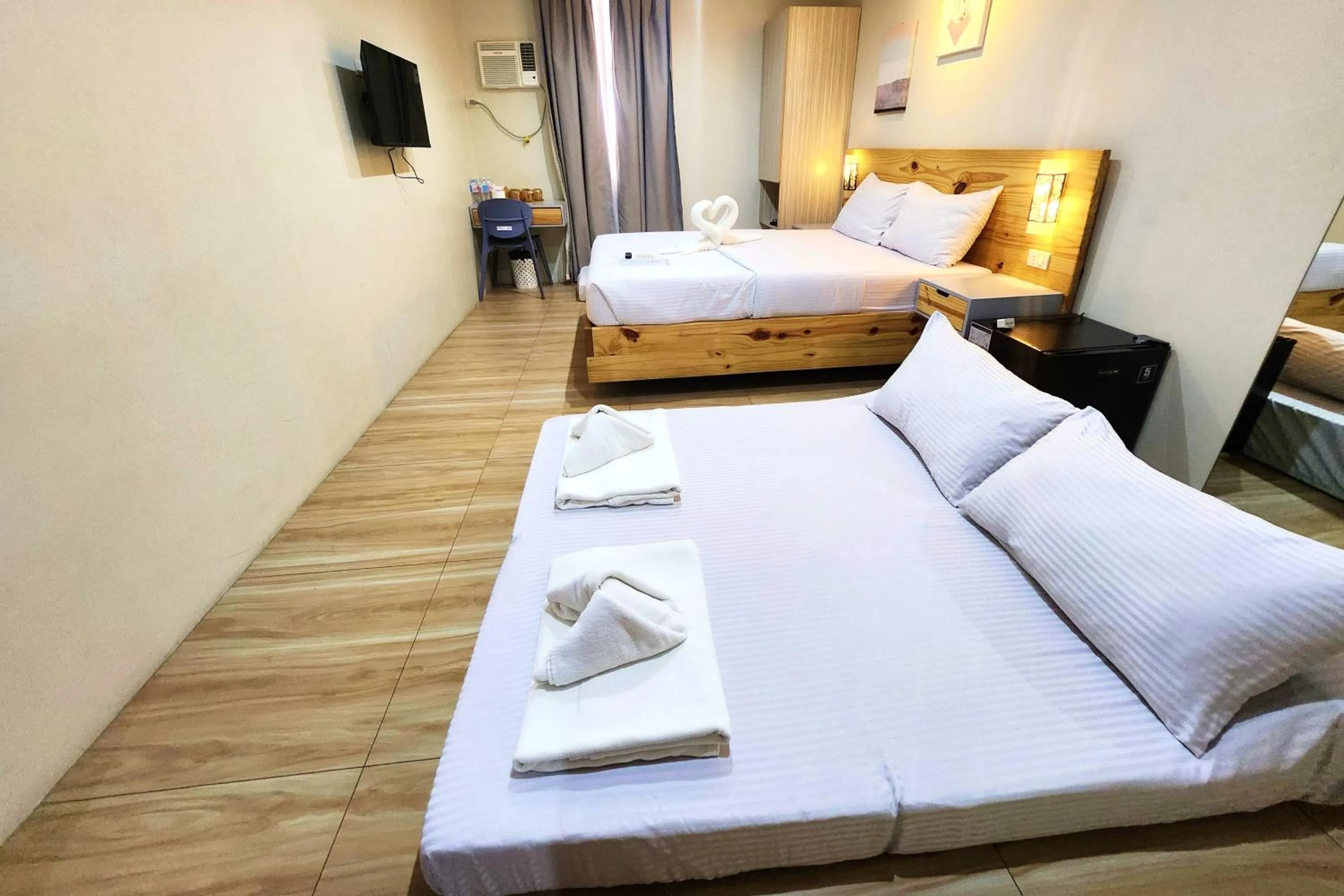 Bed in DLT Suites Cebu powered by Cocotel