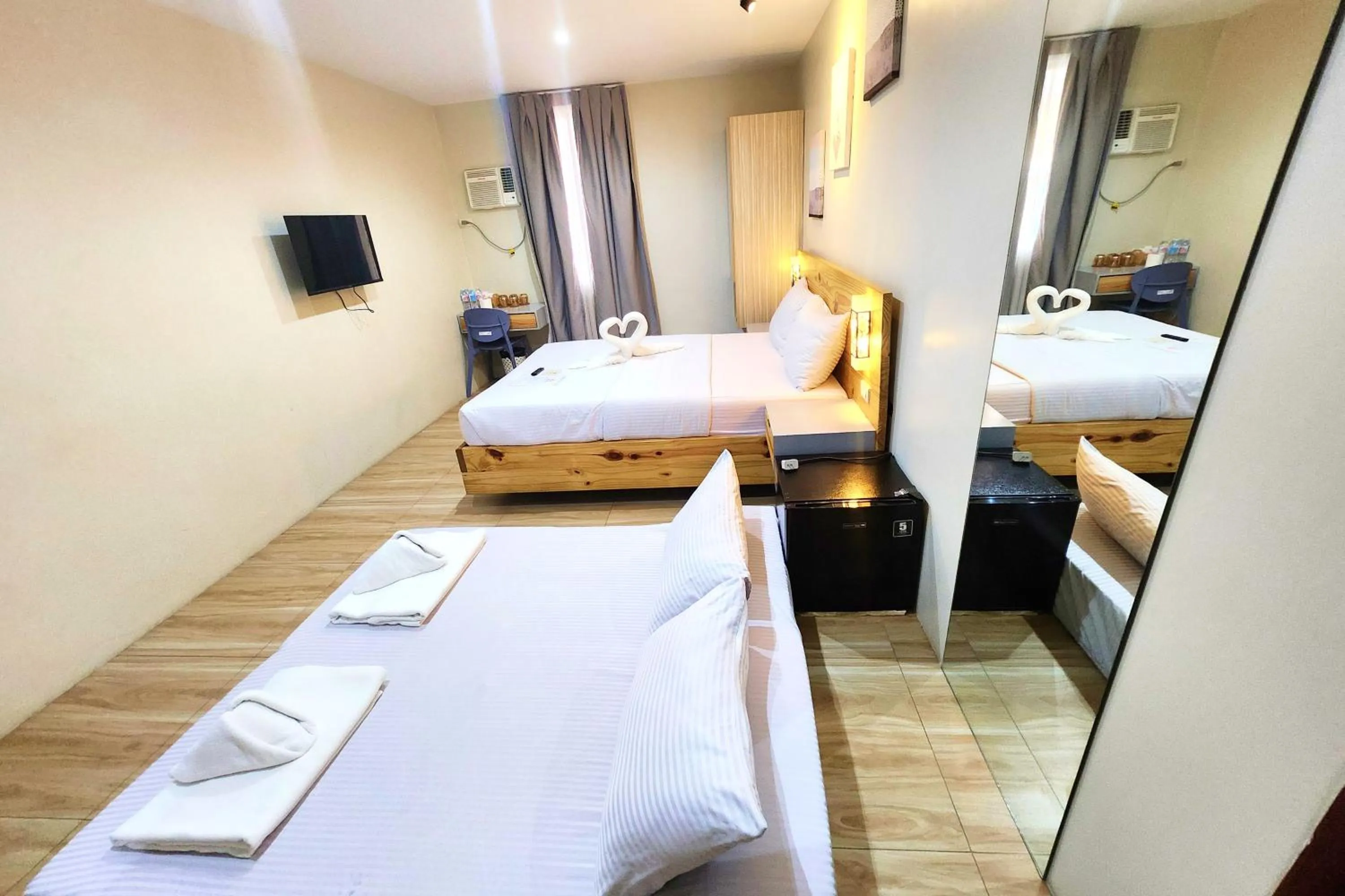 Bed in DLT Suites Cebu powered by Cocotel