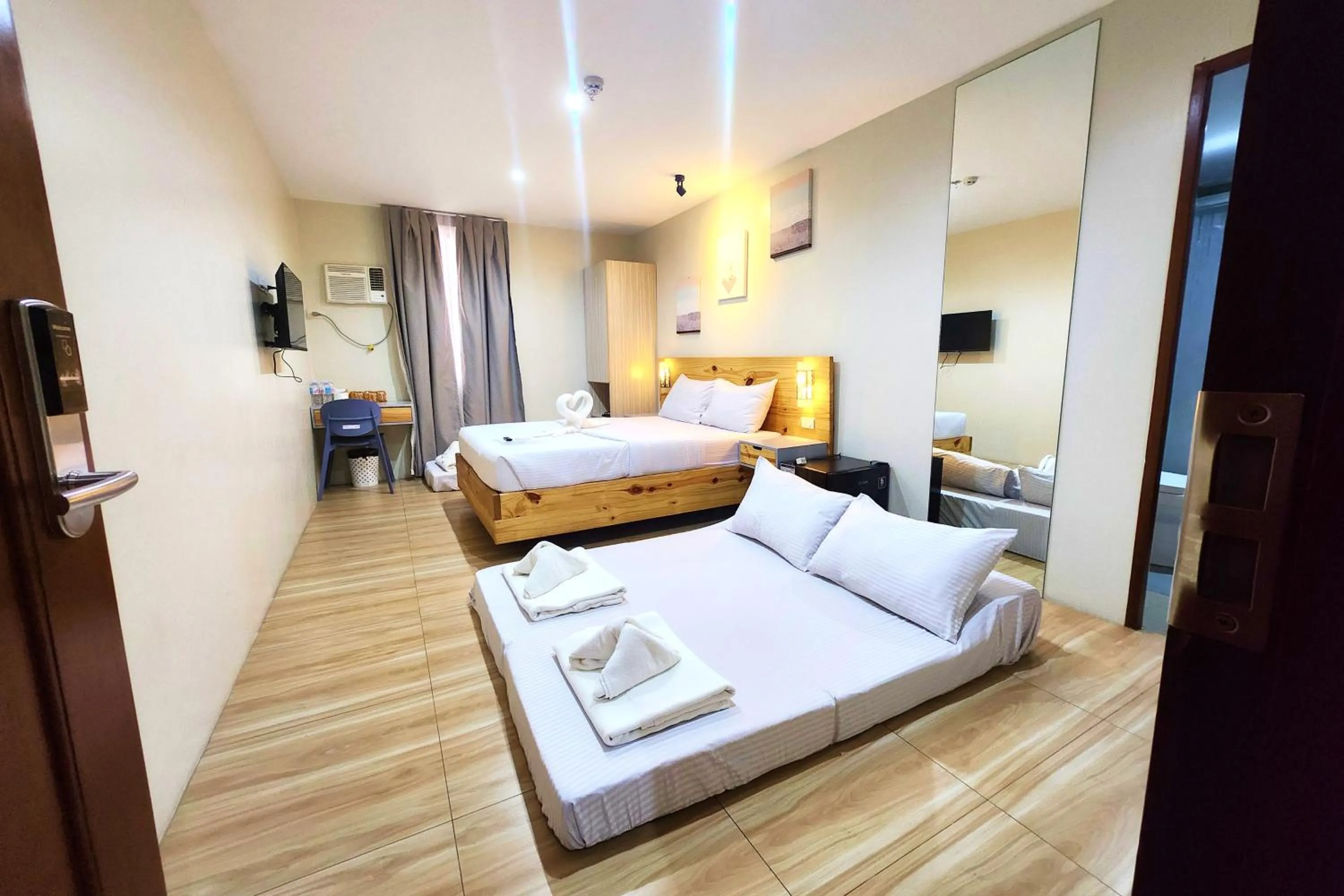 Bed in DLT Suites Cebu powered by Cocotel