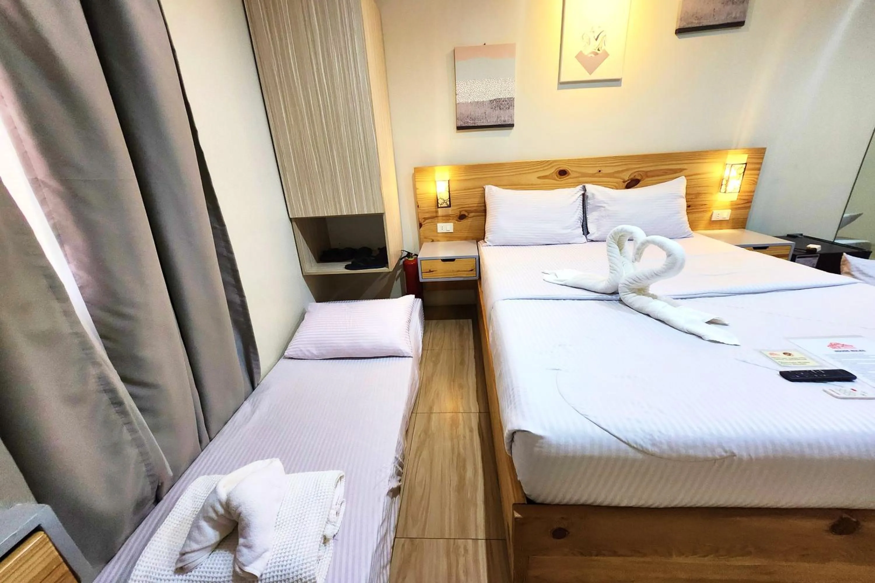 Bed in DLT Suites Cebu powered by Cocotel