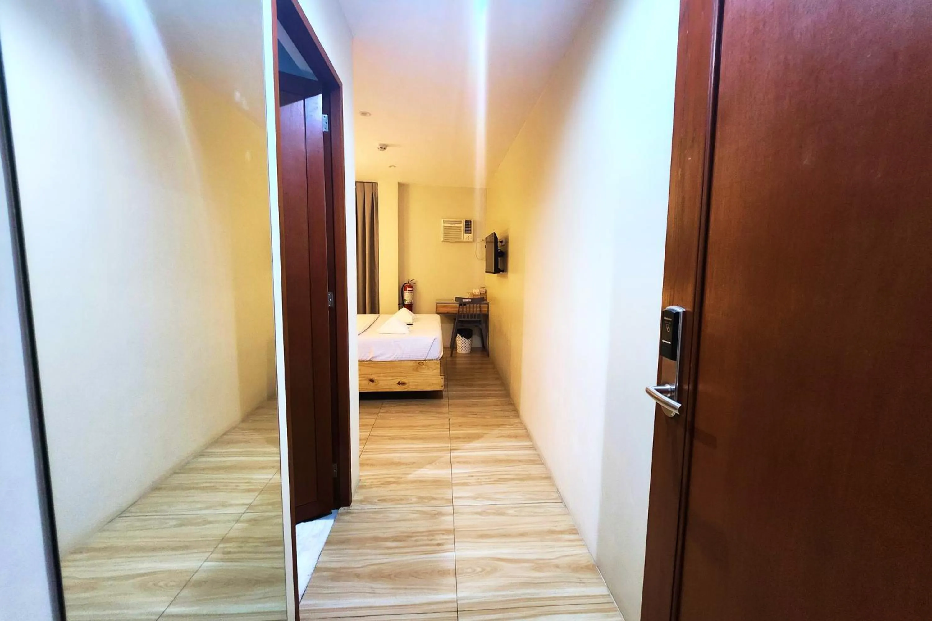 Bed in DLT Suites Cebu powered by Cocotel