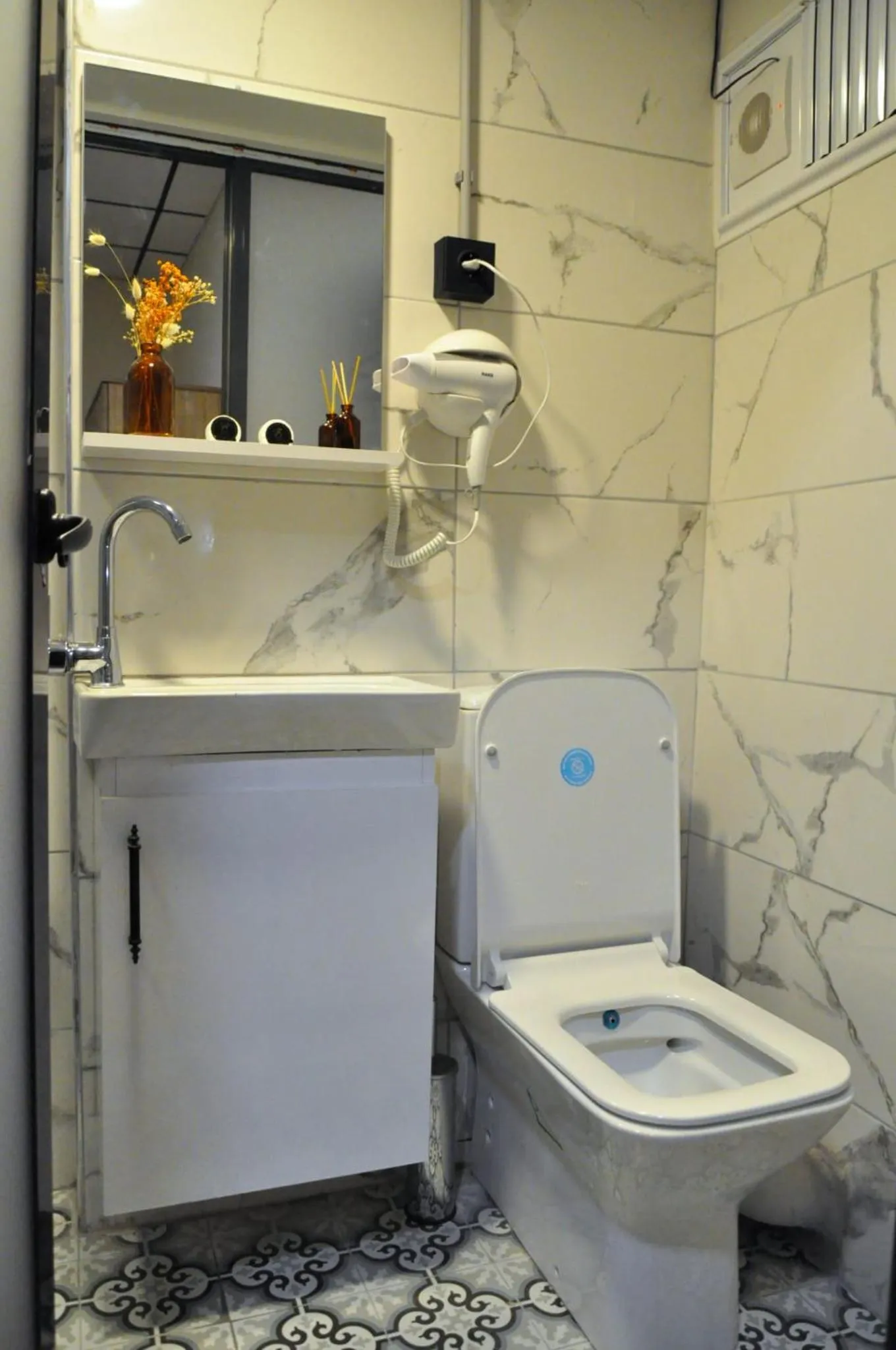 Toilet in Golden Door Hotel