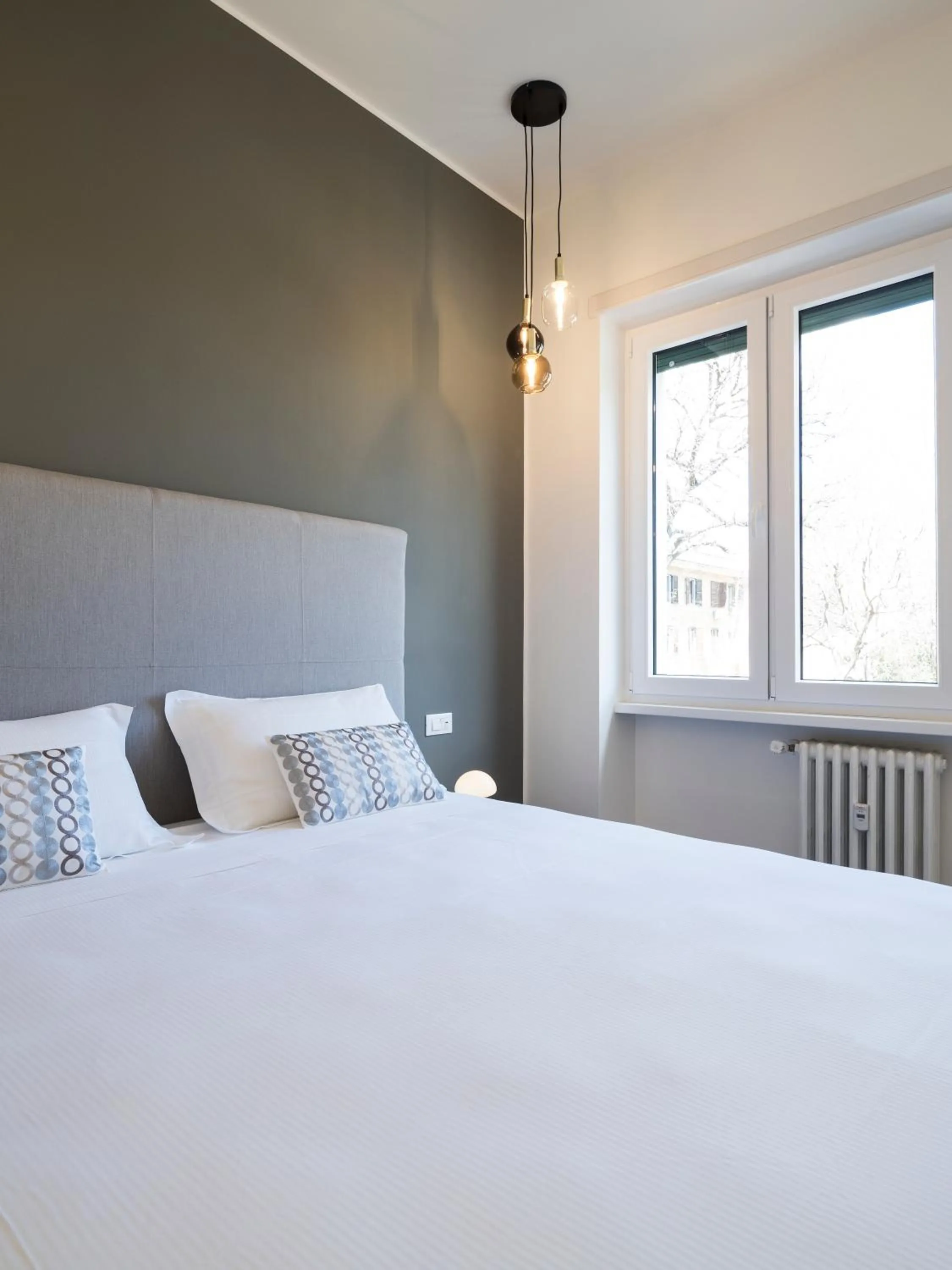 Bed in Savoia Rooms Roma