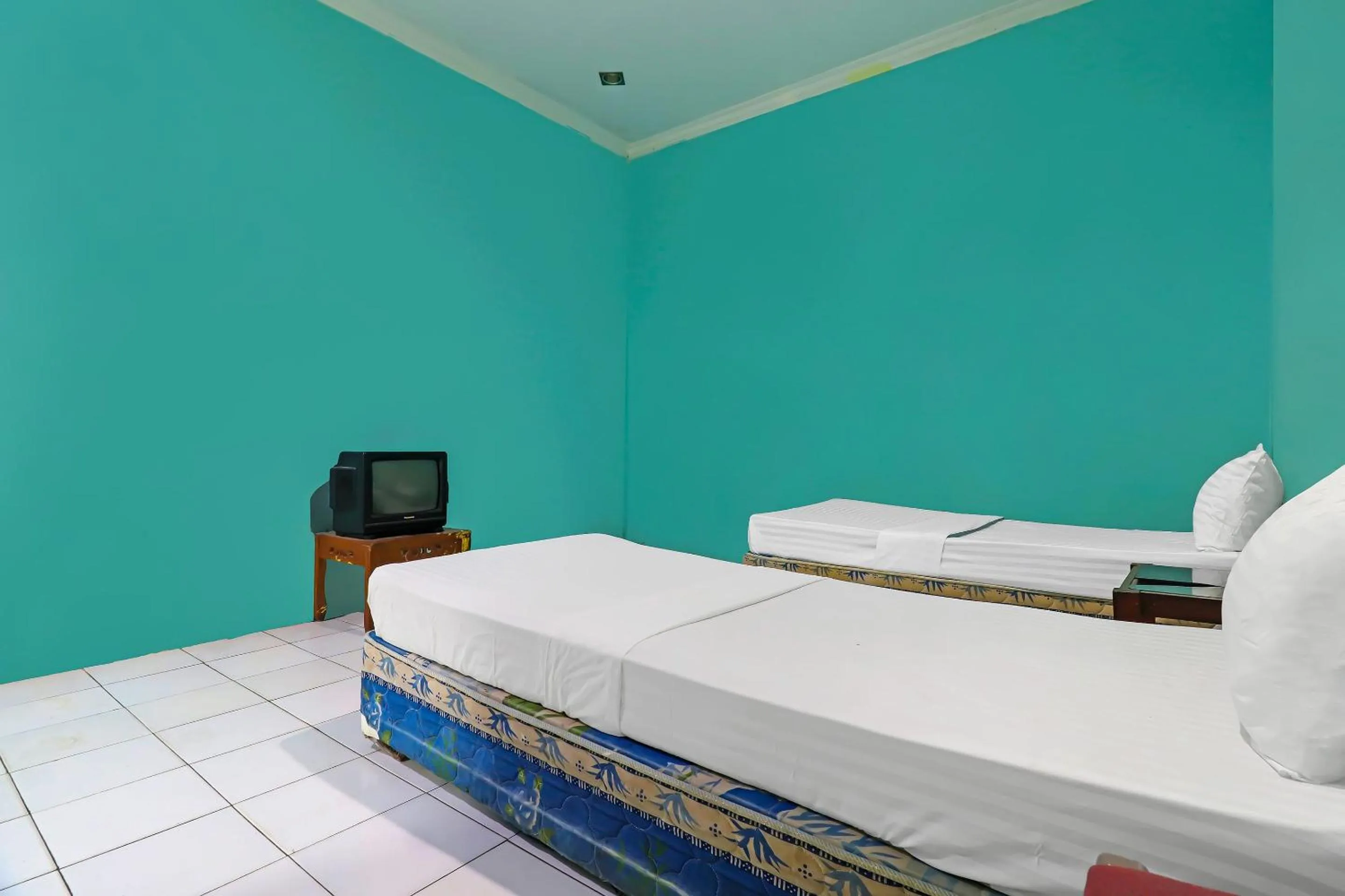 Bedroom in Hotel O Wisma Permata Syariah