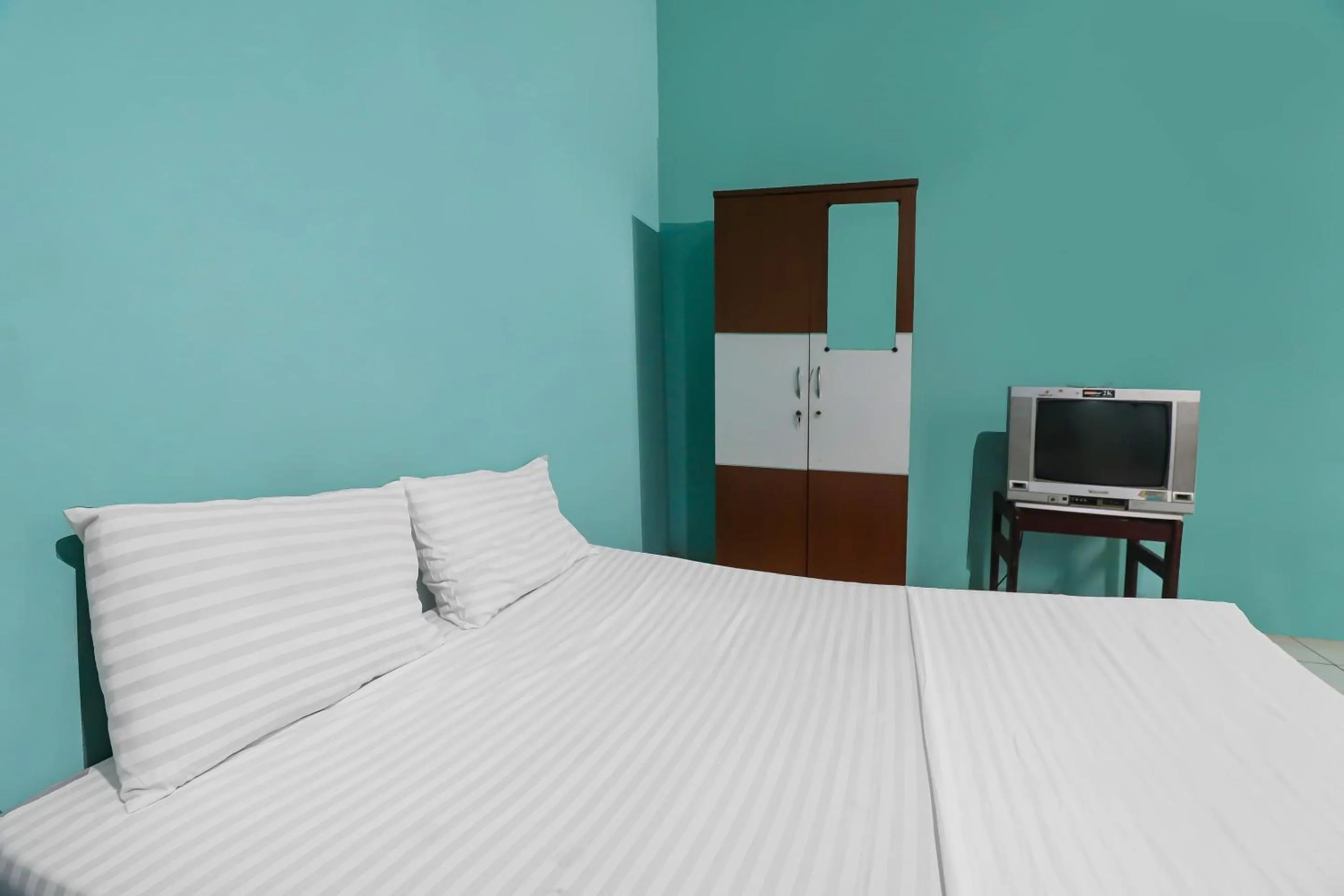 Bedroom in Hotel O Wisma Permata Syariah