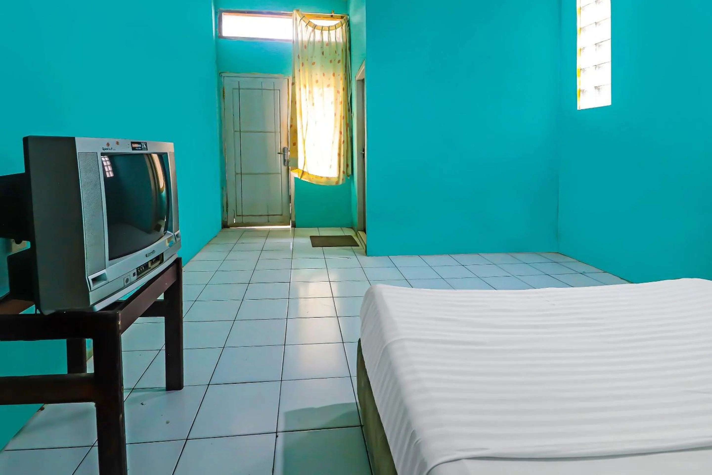 Bedroom in Hotel O Wisma Permata Syariah