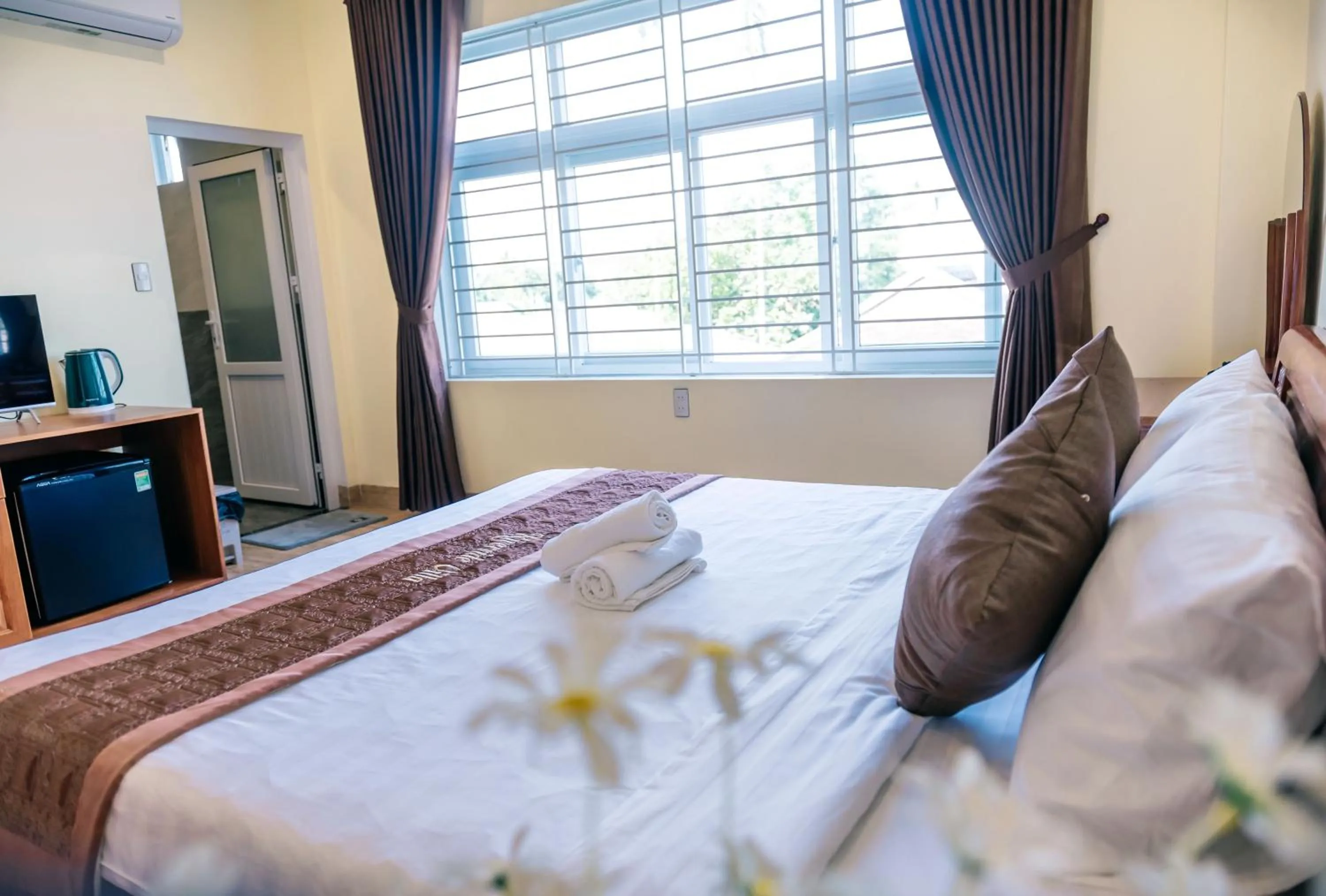 Bed in Orchid Riverside Villa