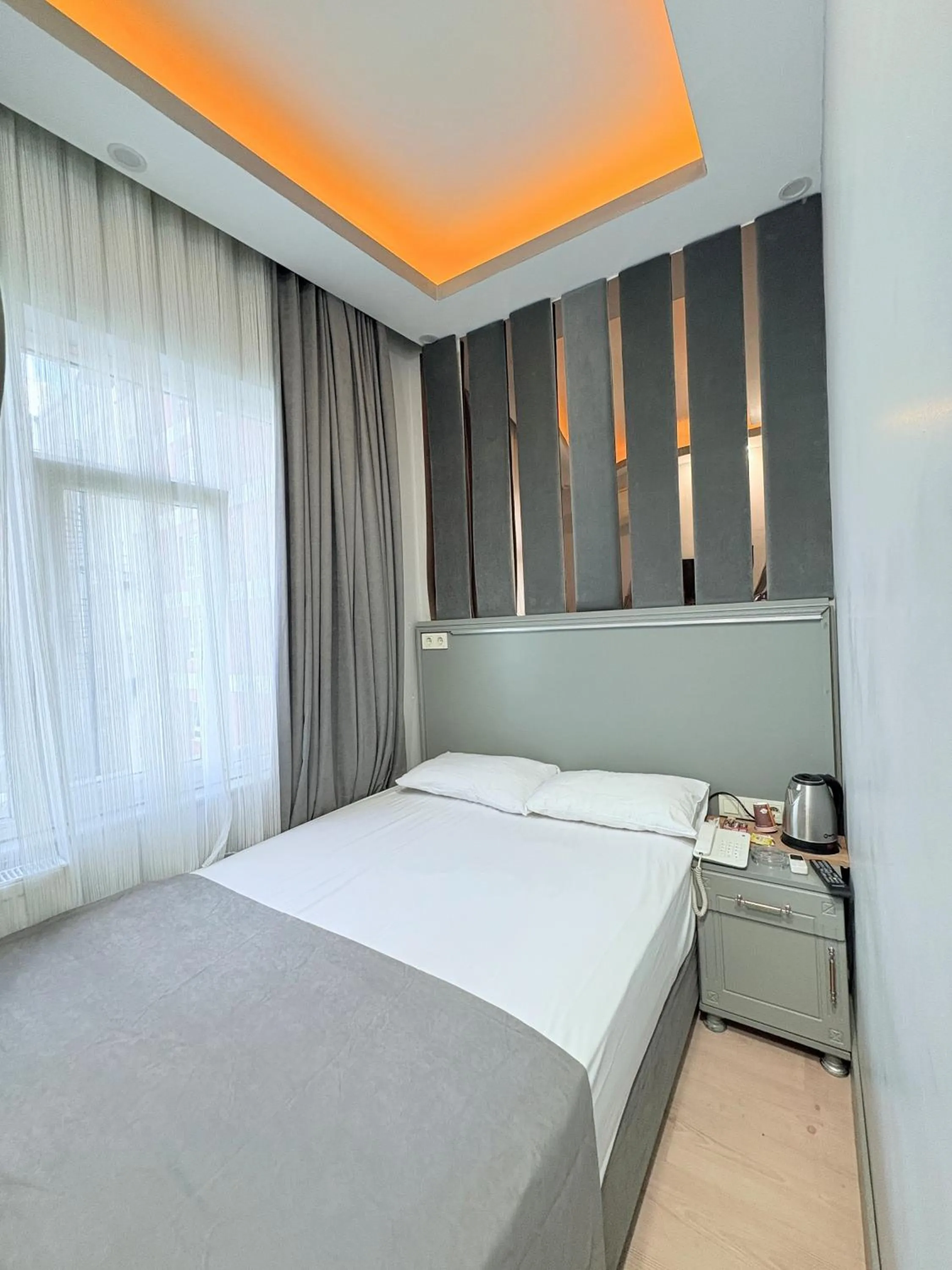 Bed in Crowned Plus Hotel