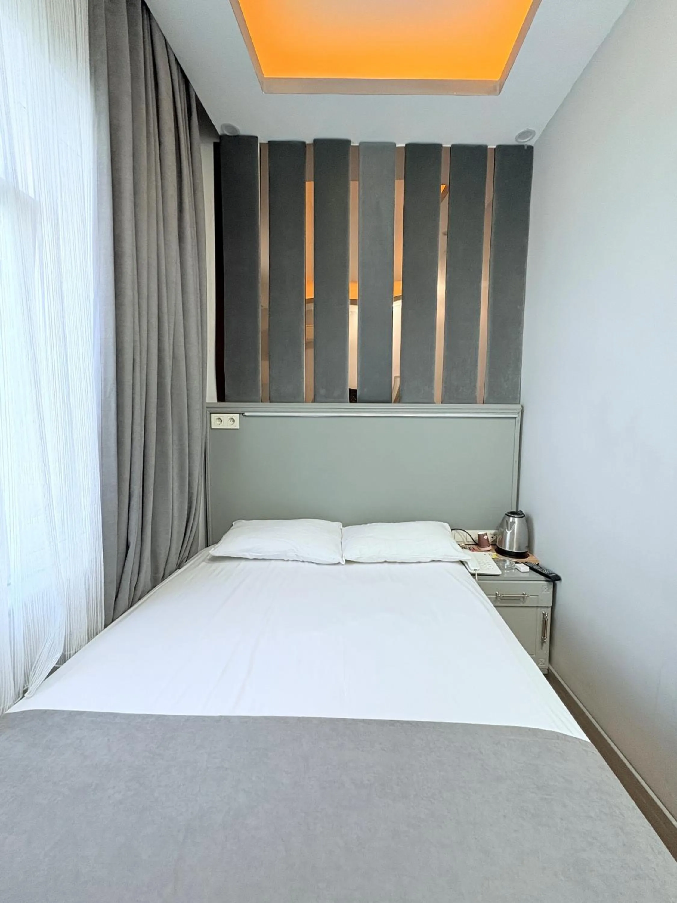 Bed in Crowned Plus Hotel