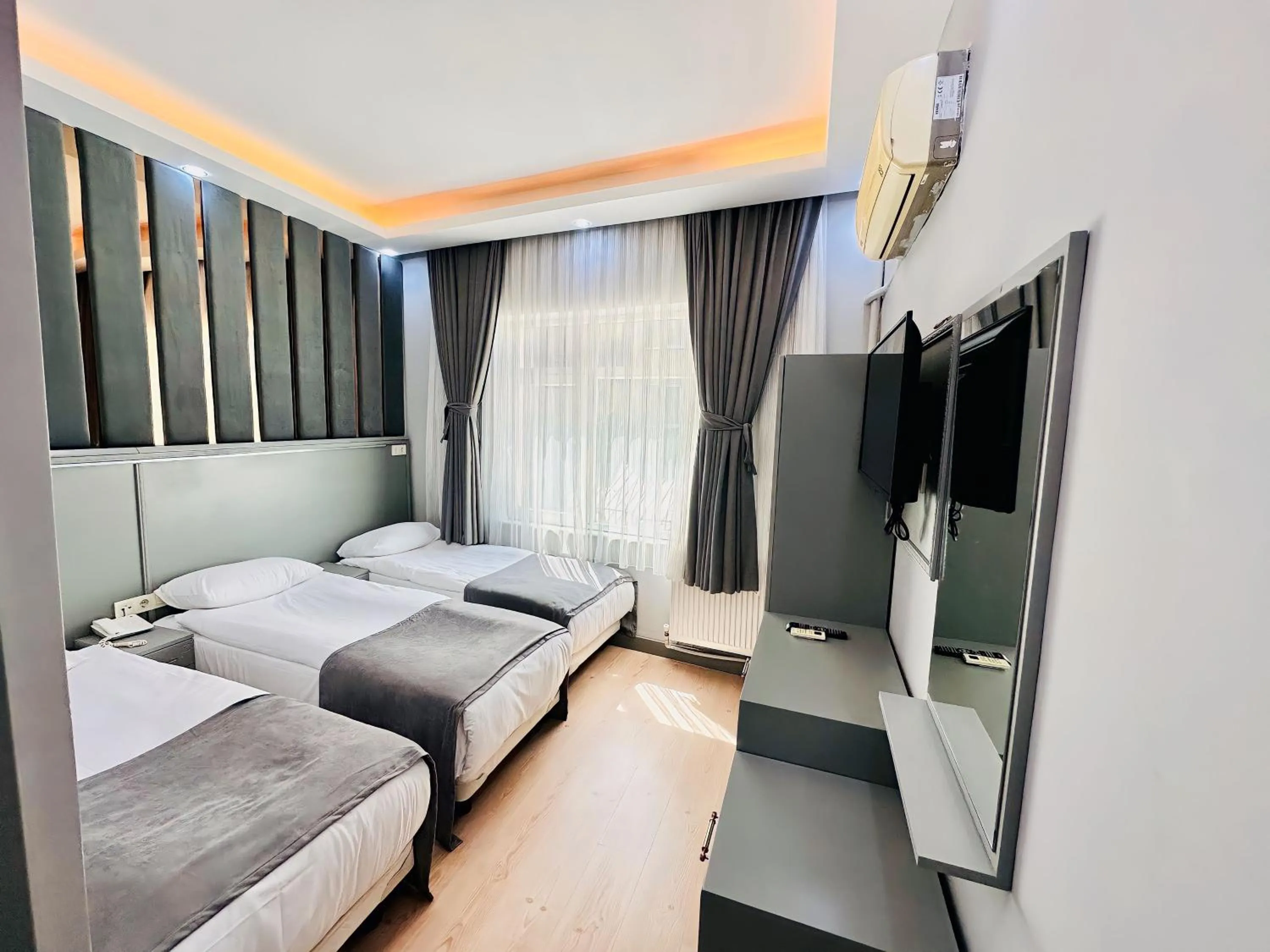 Bed in Crowned Plus Hotel