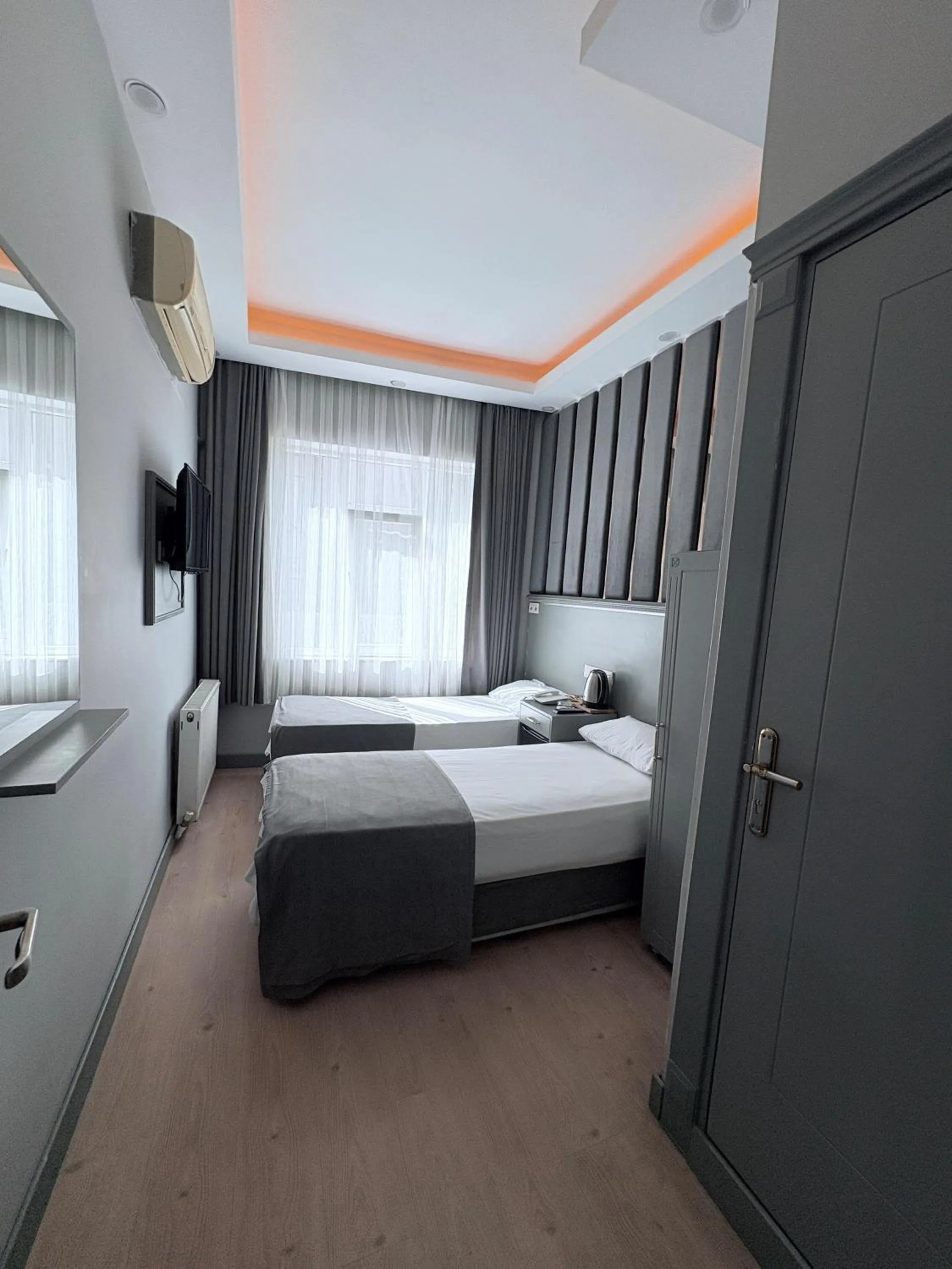 Bed in Crowned Plus Hotel