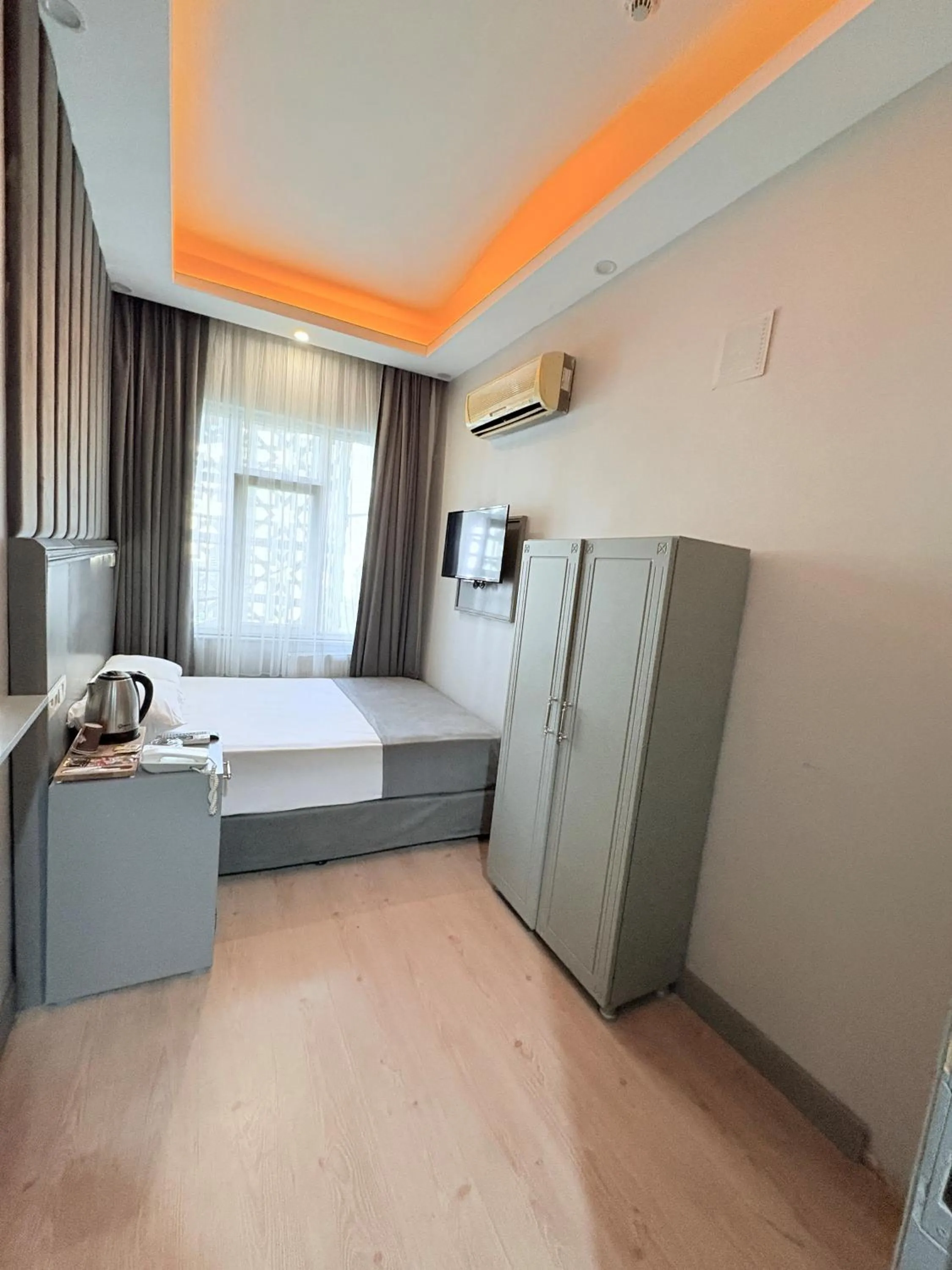 Bed in Crowned Plus Hotel