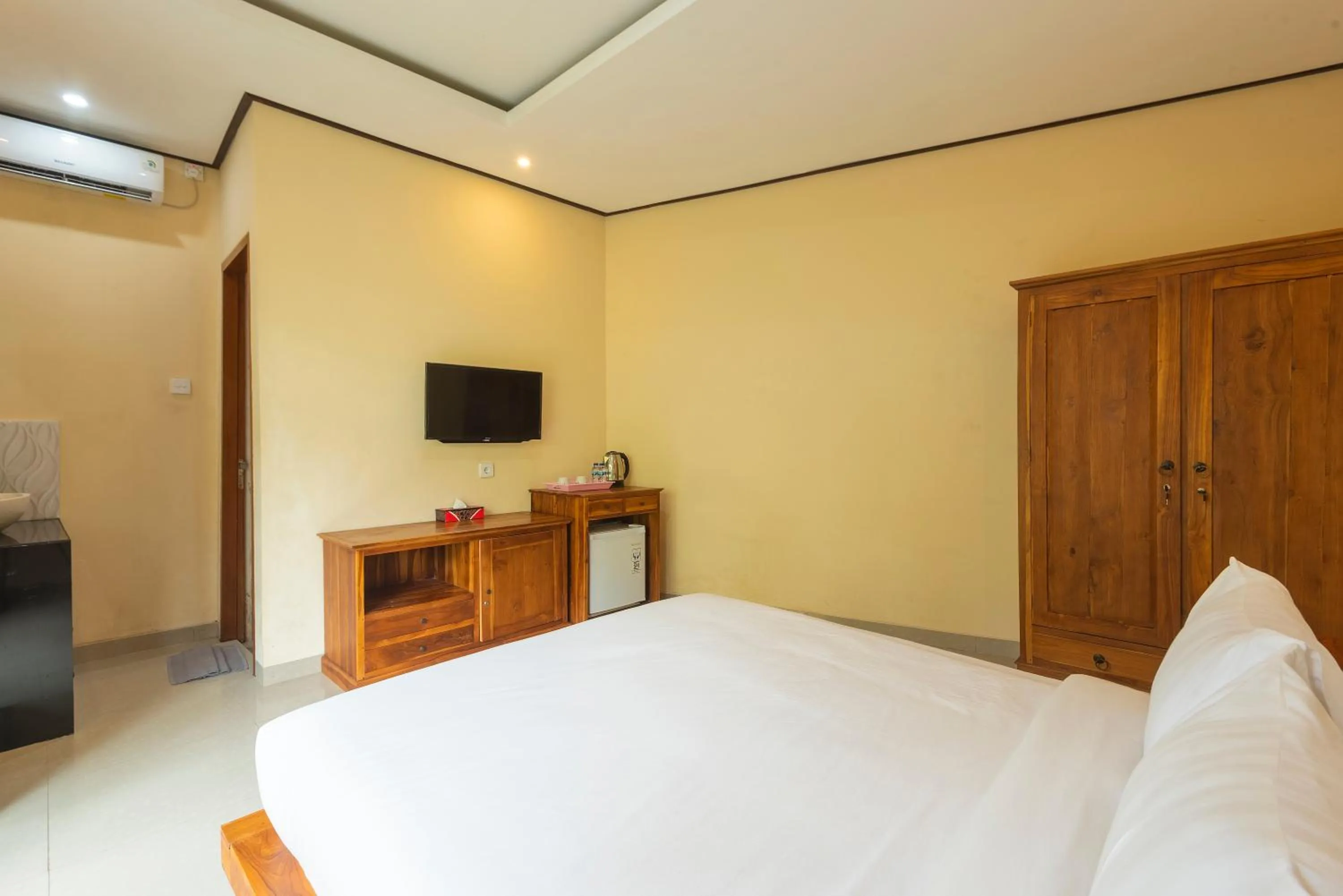 Bed in Liliy Guest House Legian