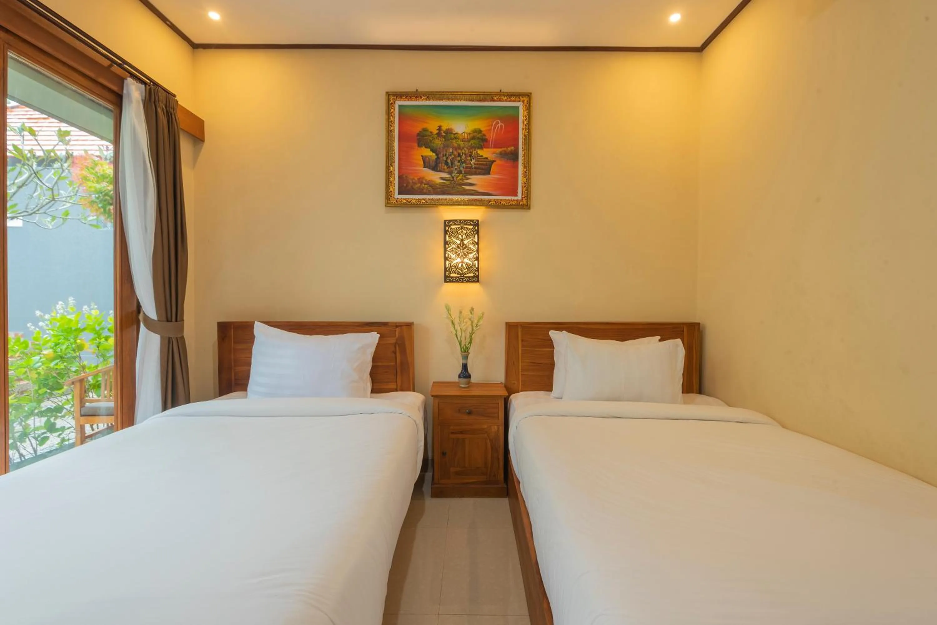 Bed in Liliy Guest House Legian