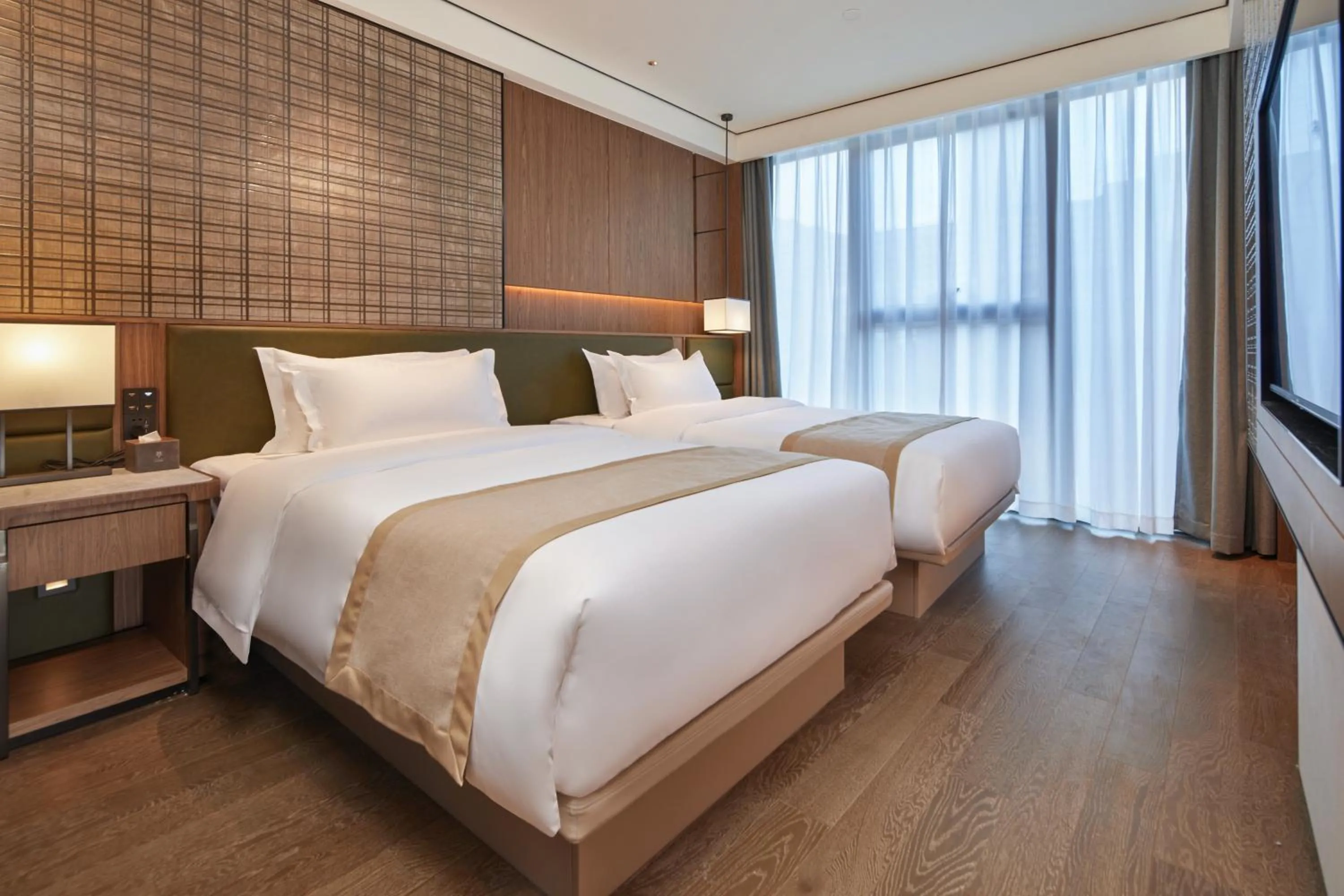 Bed in Dongguan Tangxia Huaman Hotel