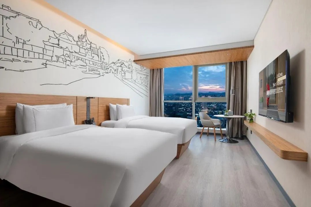 Bed in UrCove by HYATT Nanjing South Railway Station