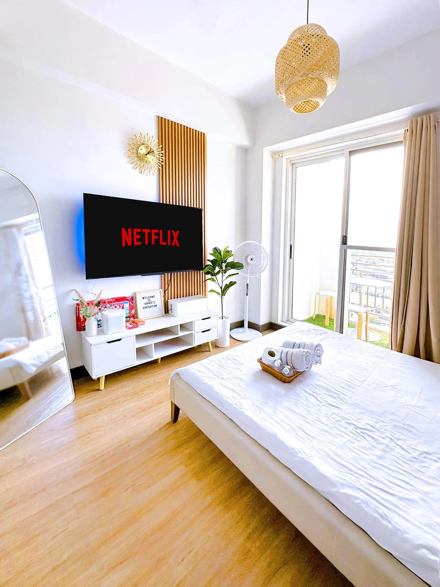 Bed in Zinnia Towers 1BR Condo with PS4 Karaoke Netflix & Swimming Pool