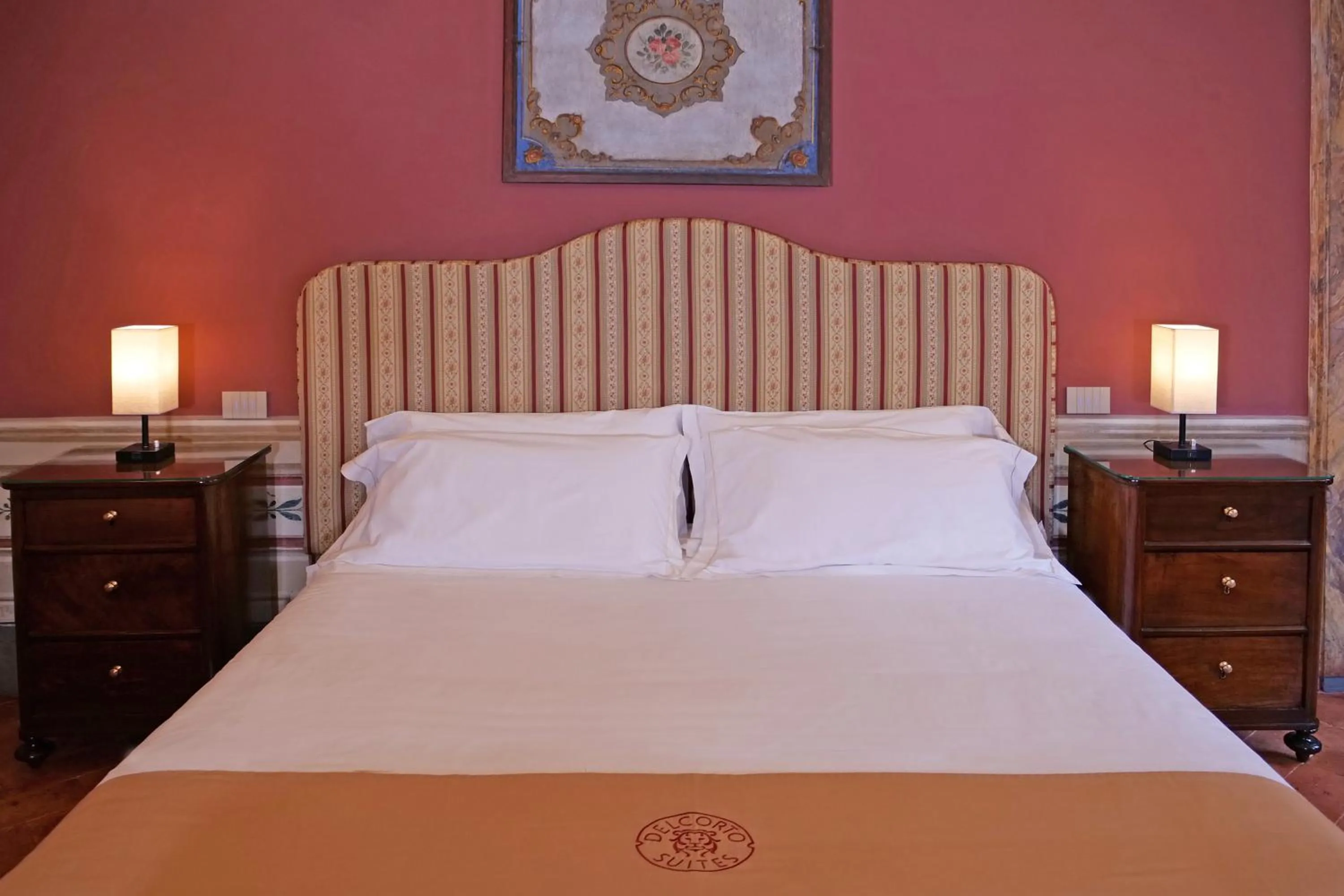 Bed in Delcorto Suites