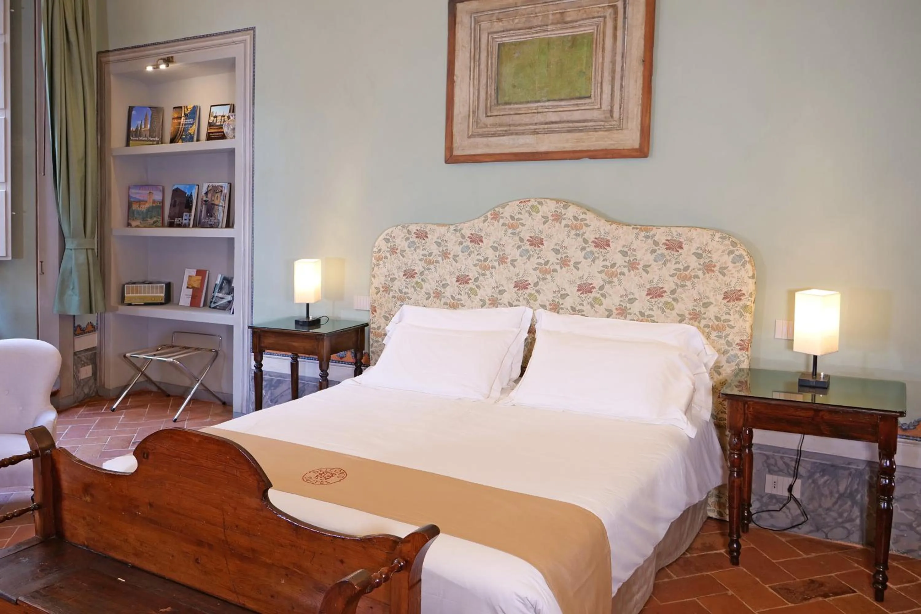 Bed in Delcorto Suites