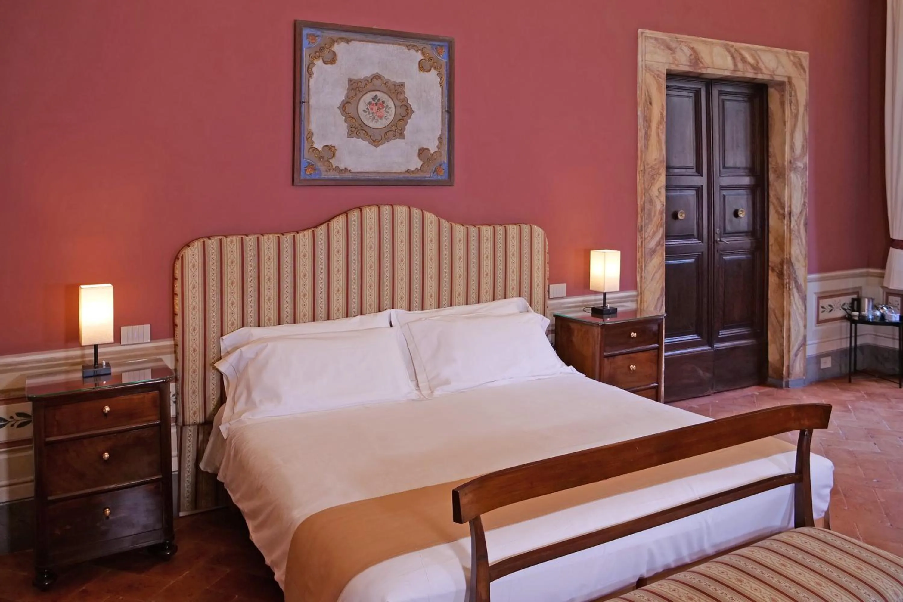 Bed in Delcorto Suites