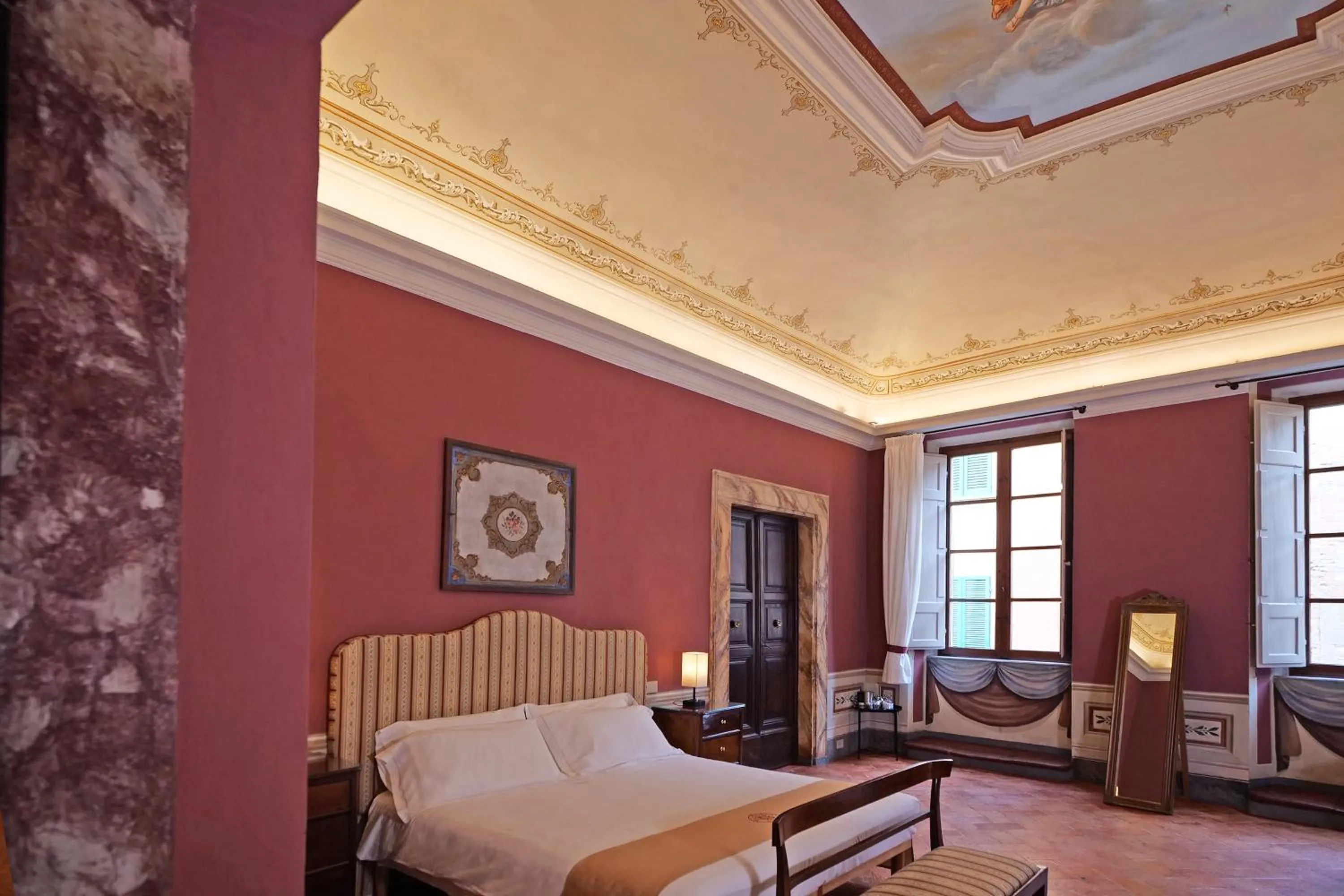 Bed in Delcorto Suites