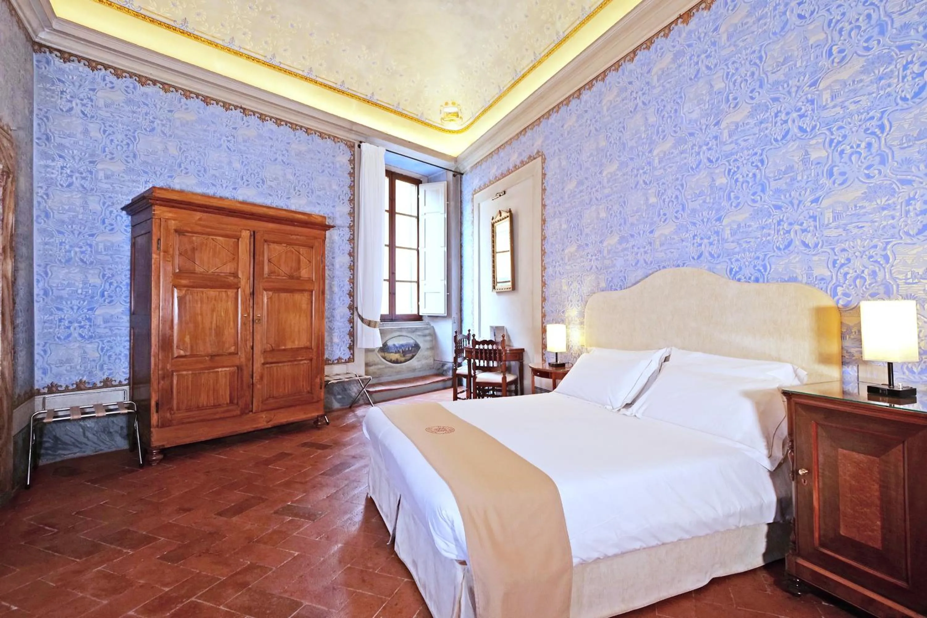 Bed in Delcorto Suites