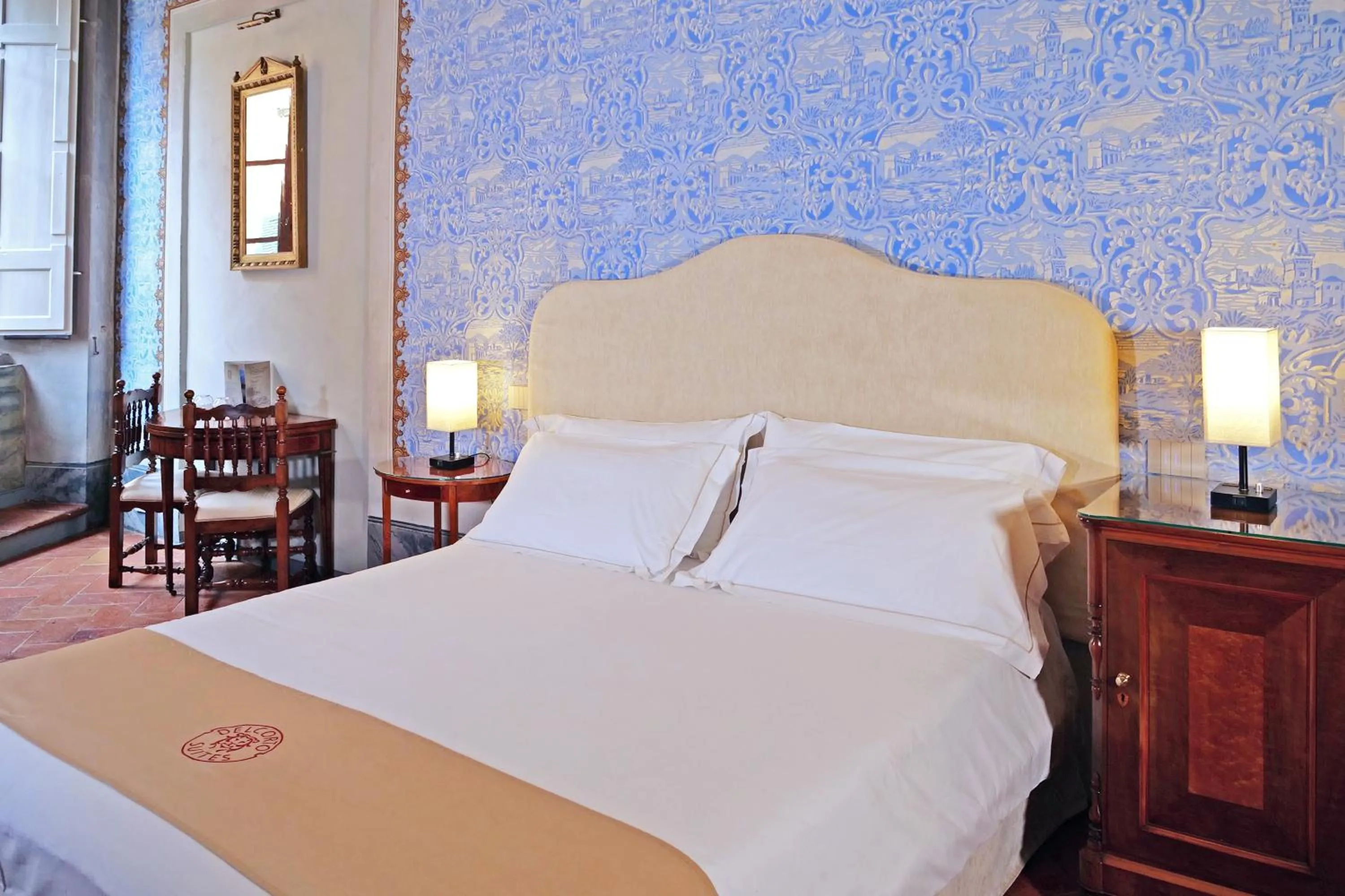 Bed in Delcorto Suites