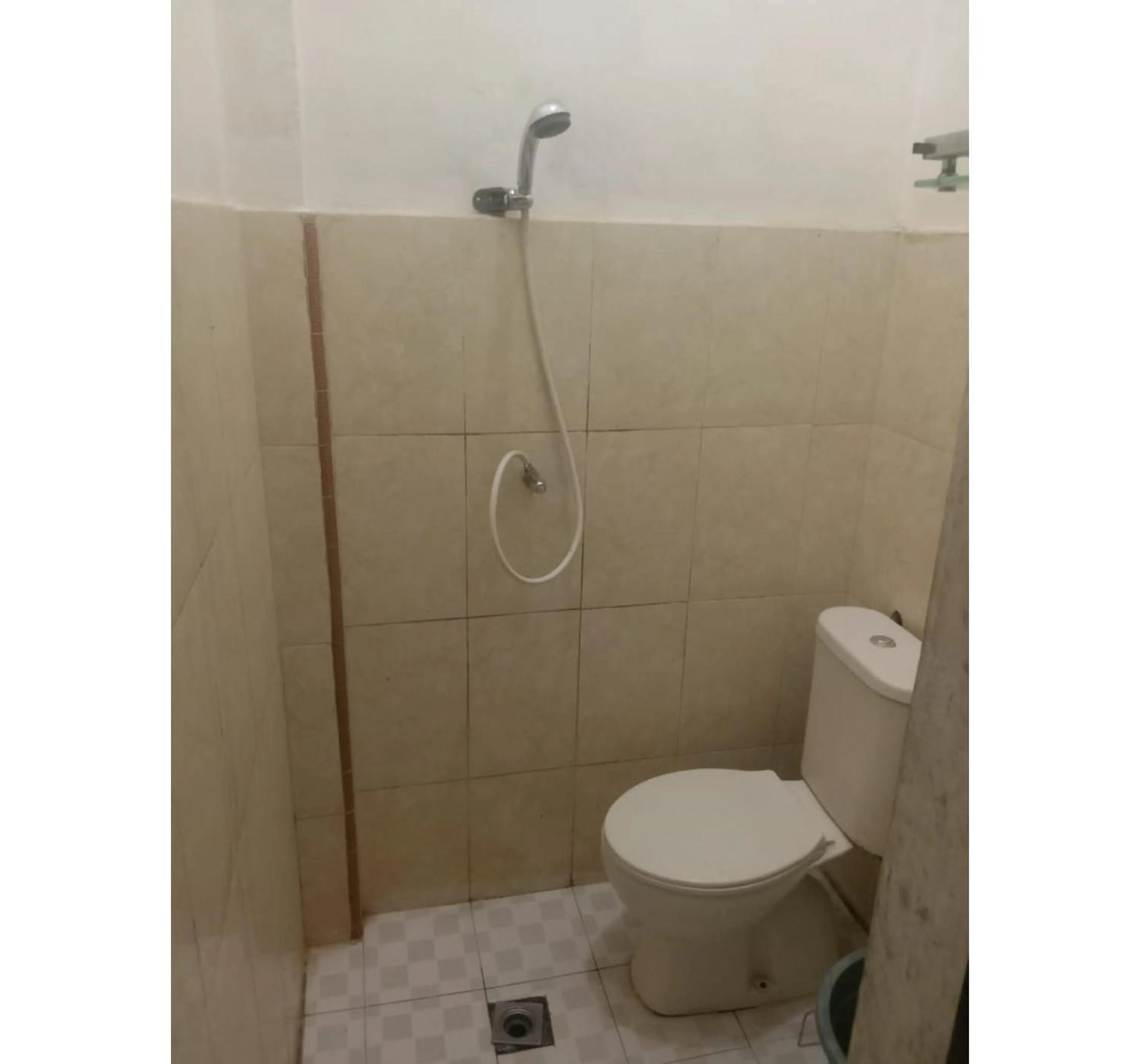 Bathroom in Hotel O Penginapan & Villa Sirait