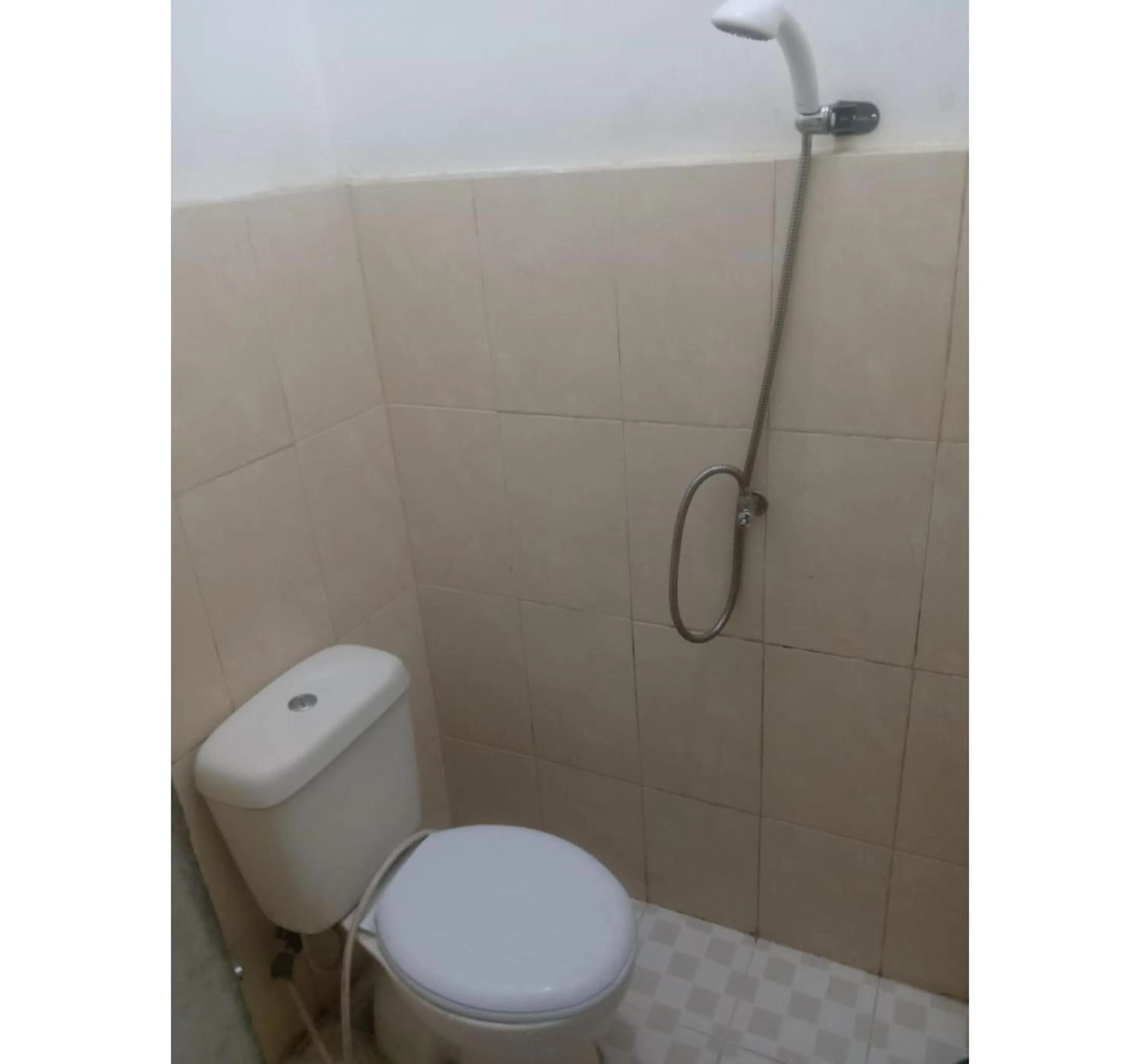 Bathroom in Hotel O Penginapan & Villa Sirait