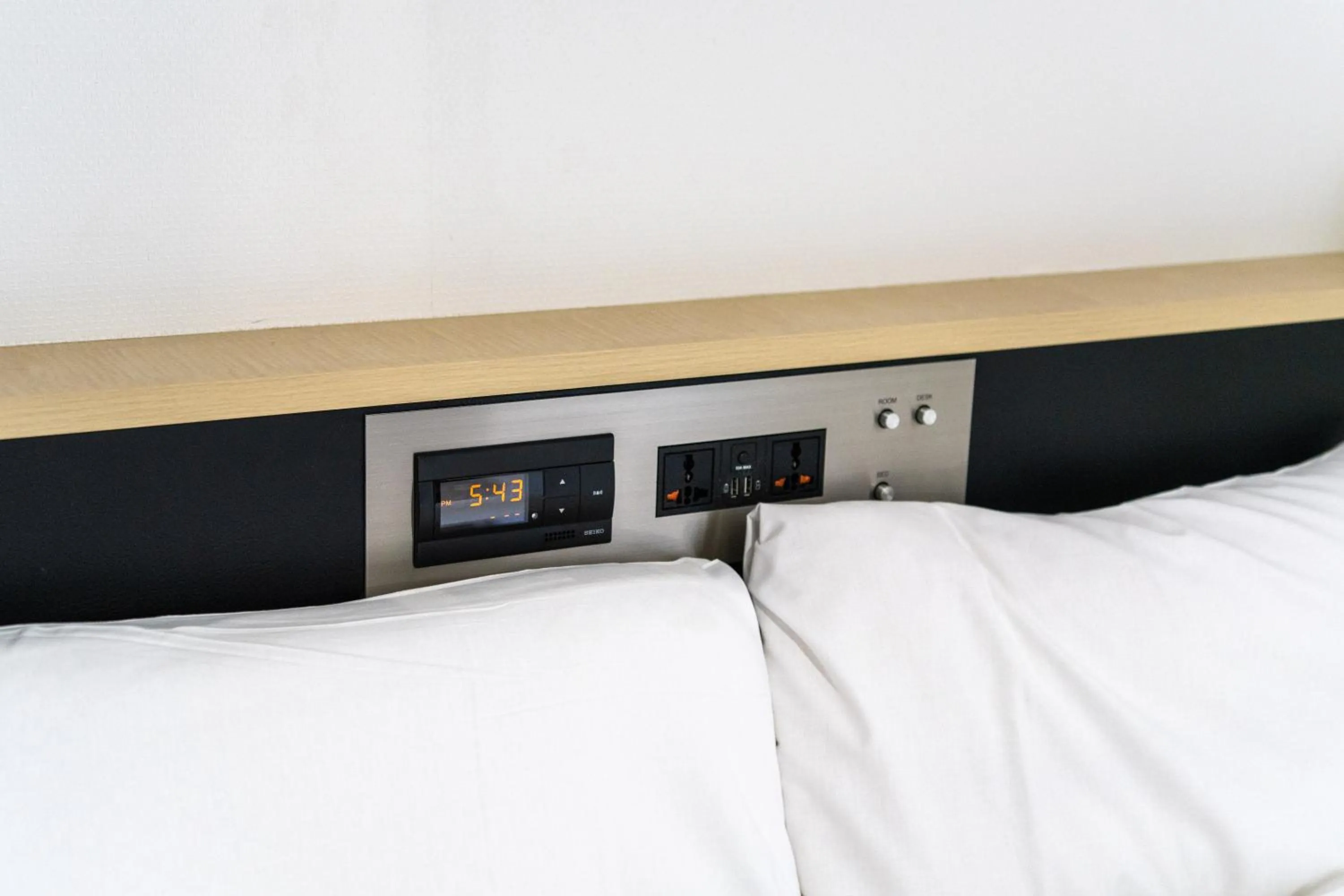 Bed in Ramada Encore by Wyndham Amagasaki