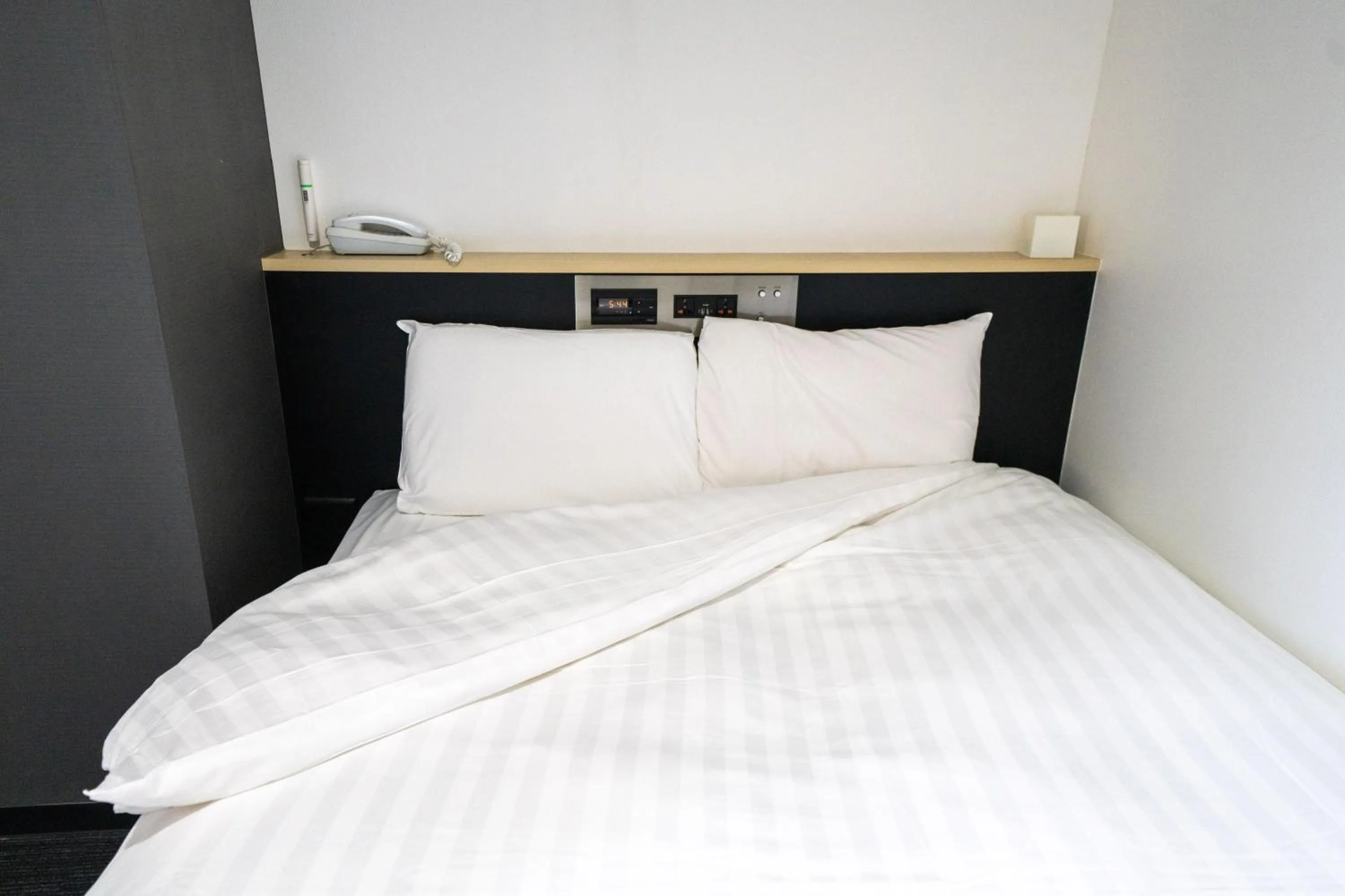 Bed in Ramada Encore by Wyndham Amagasaki