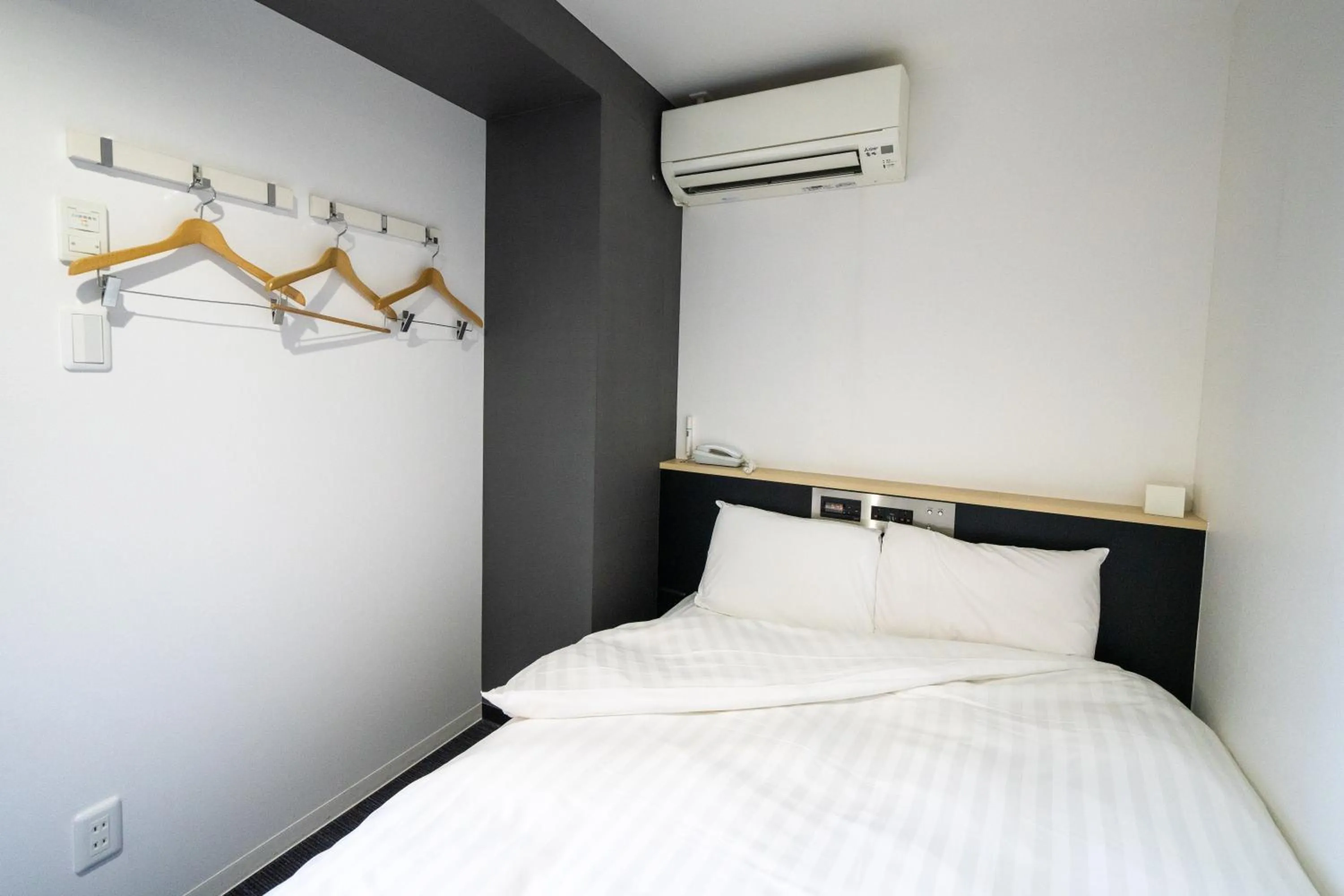 Bed in Ramada Encore by Wyndham Amagasaki