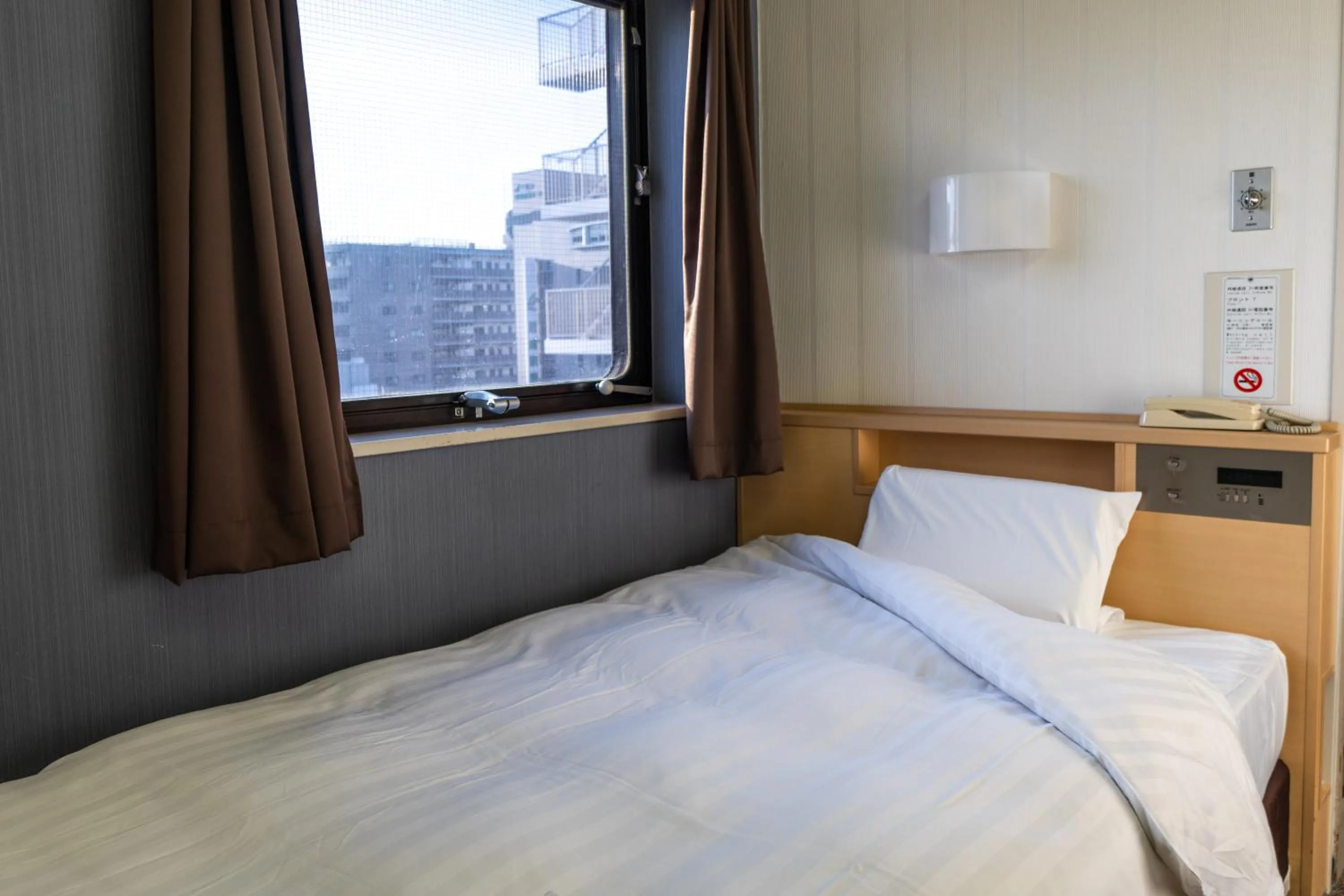 Bed in Ramada Encore by Wyndham Amagasaki