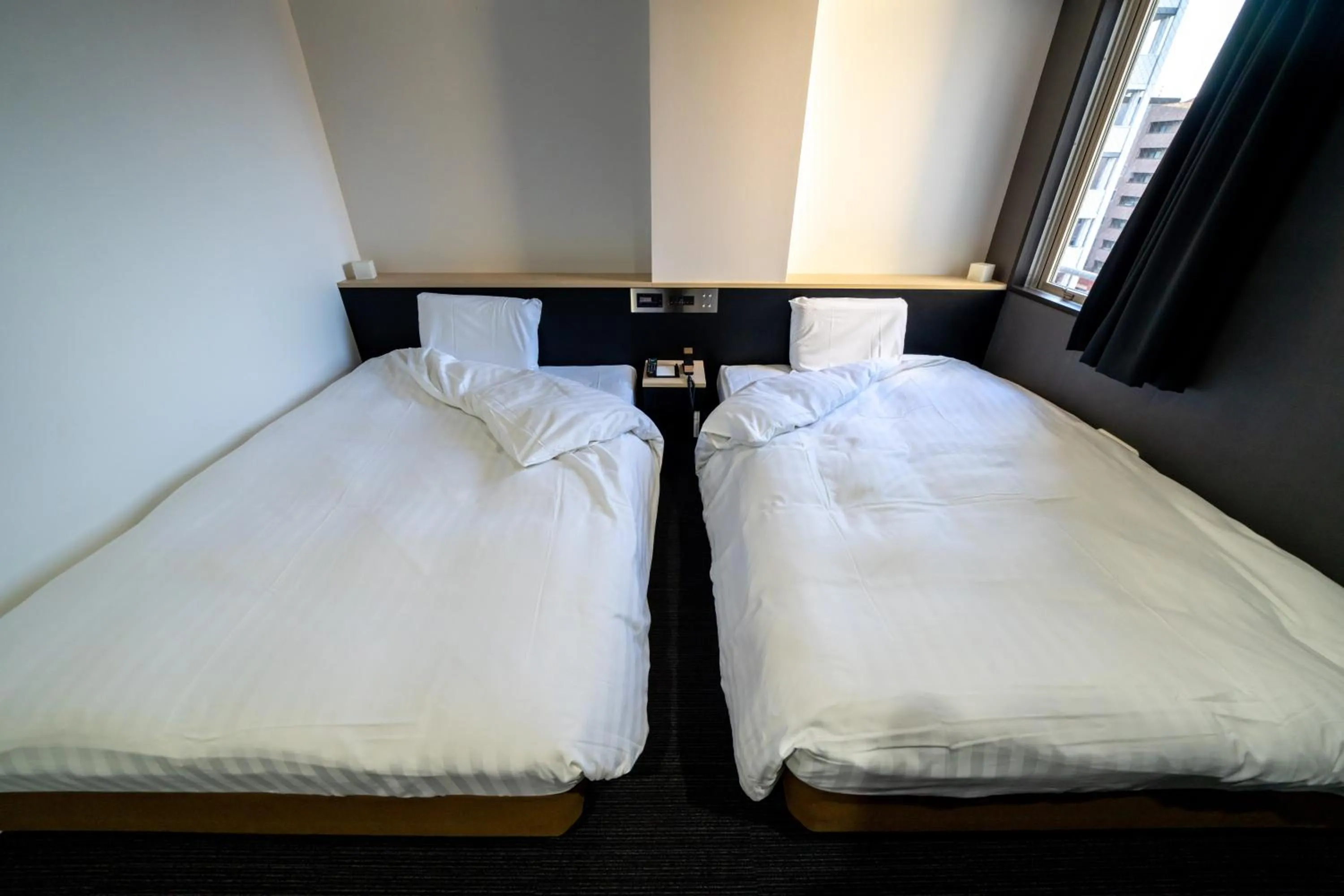 Bed in Ramada Encore by Wyndham Amagasaki