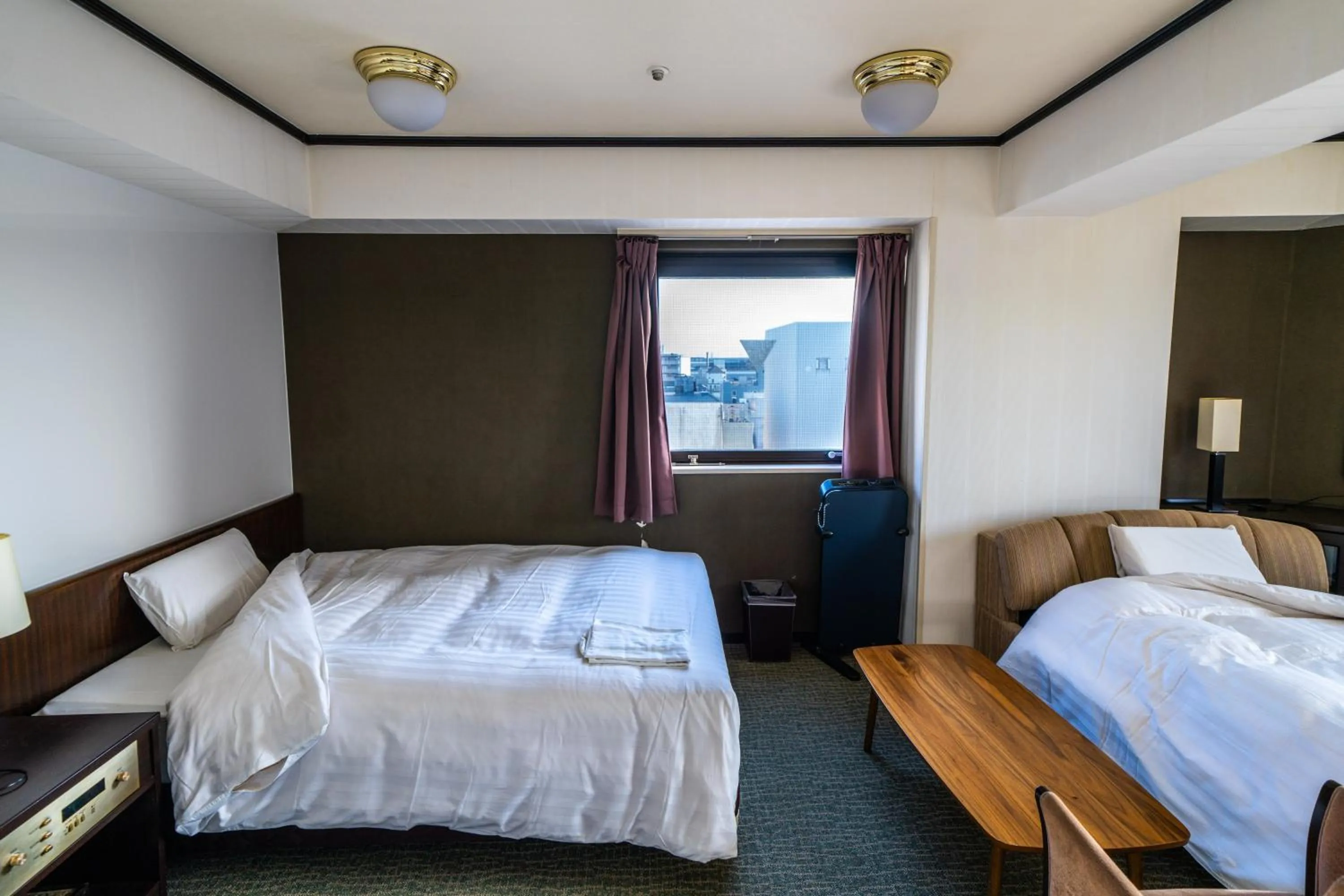 Bed in Ramada Encore by Wyndham Amagasaki