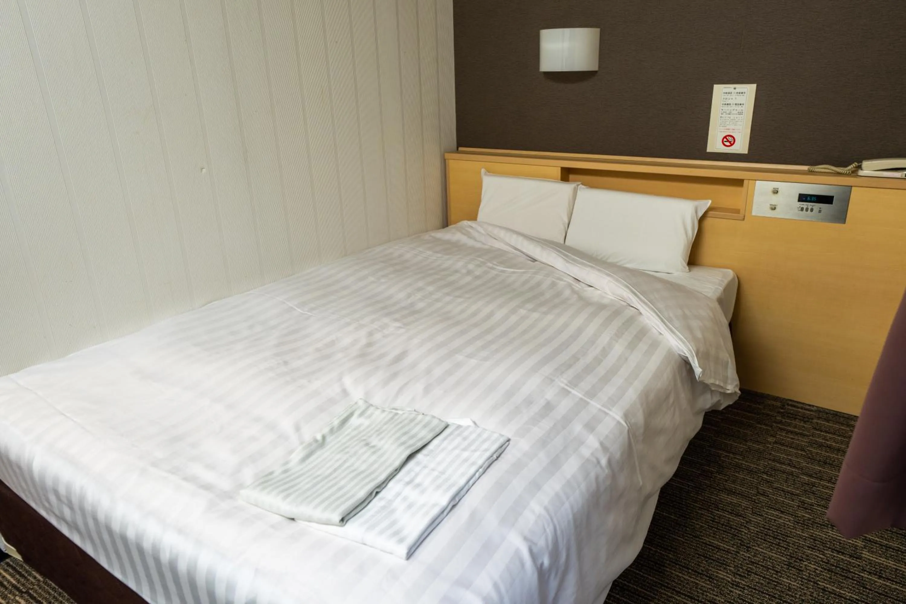 Bed in Ramada Encore by Wyndham Amagasaki