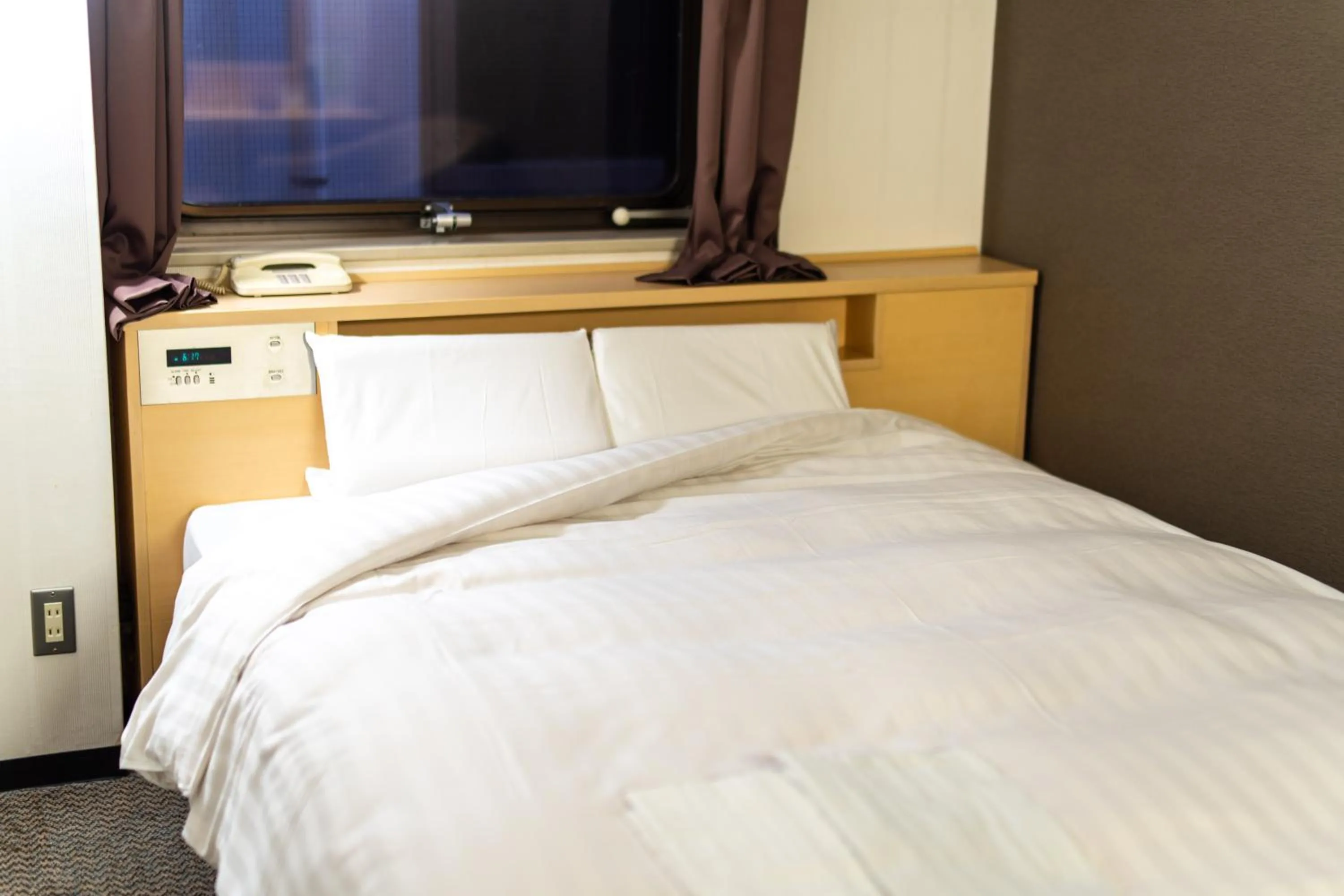 Bed in Ramada Encore by Wyndham Amagasaki