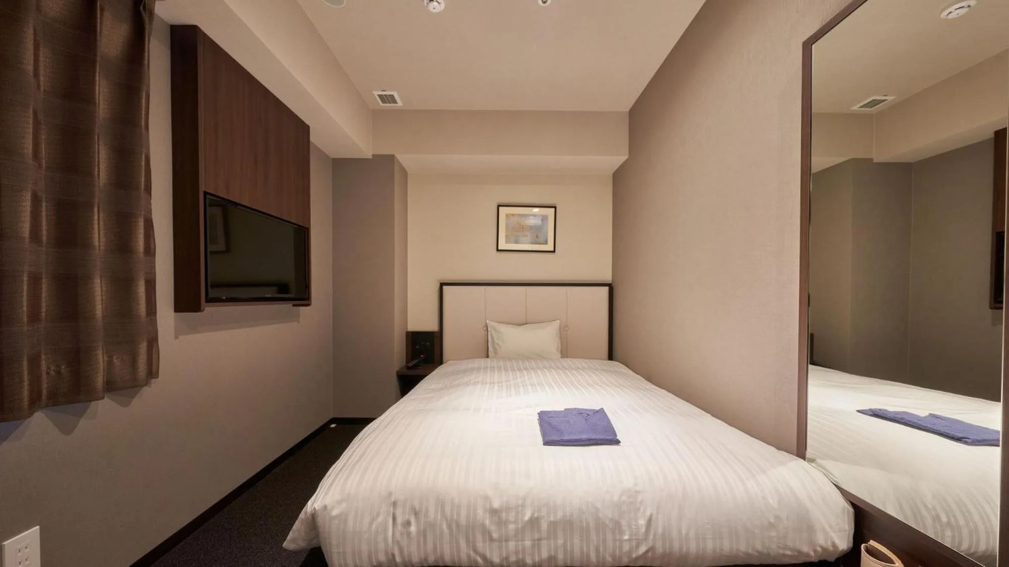 Bed in Welina Hotel Premier Nakanoshima West