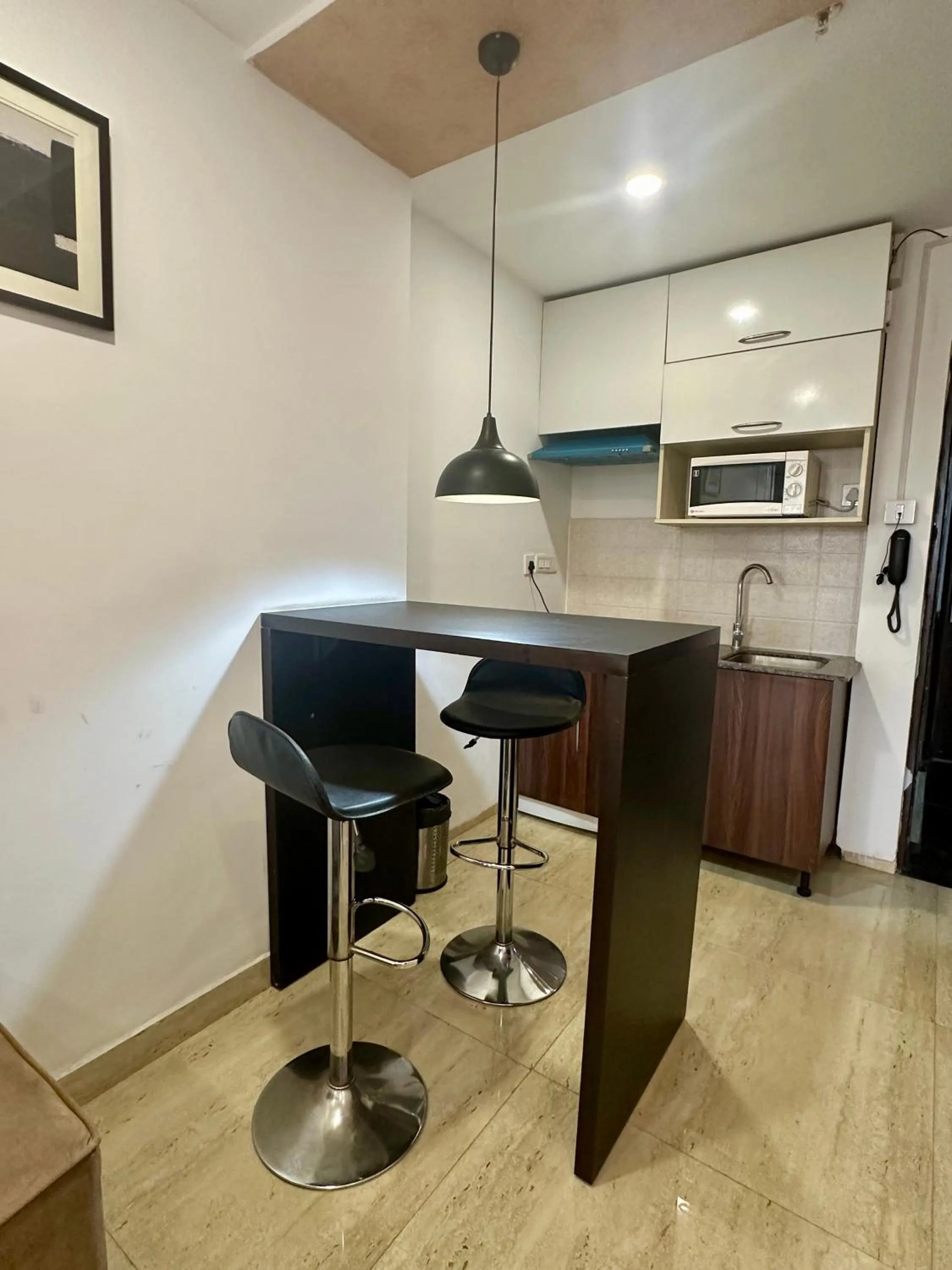 Kitchen or kitchenette in Flamingo Hotel Sector 67 I Studio Rooms I Gurgaon