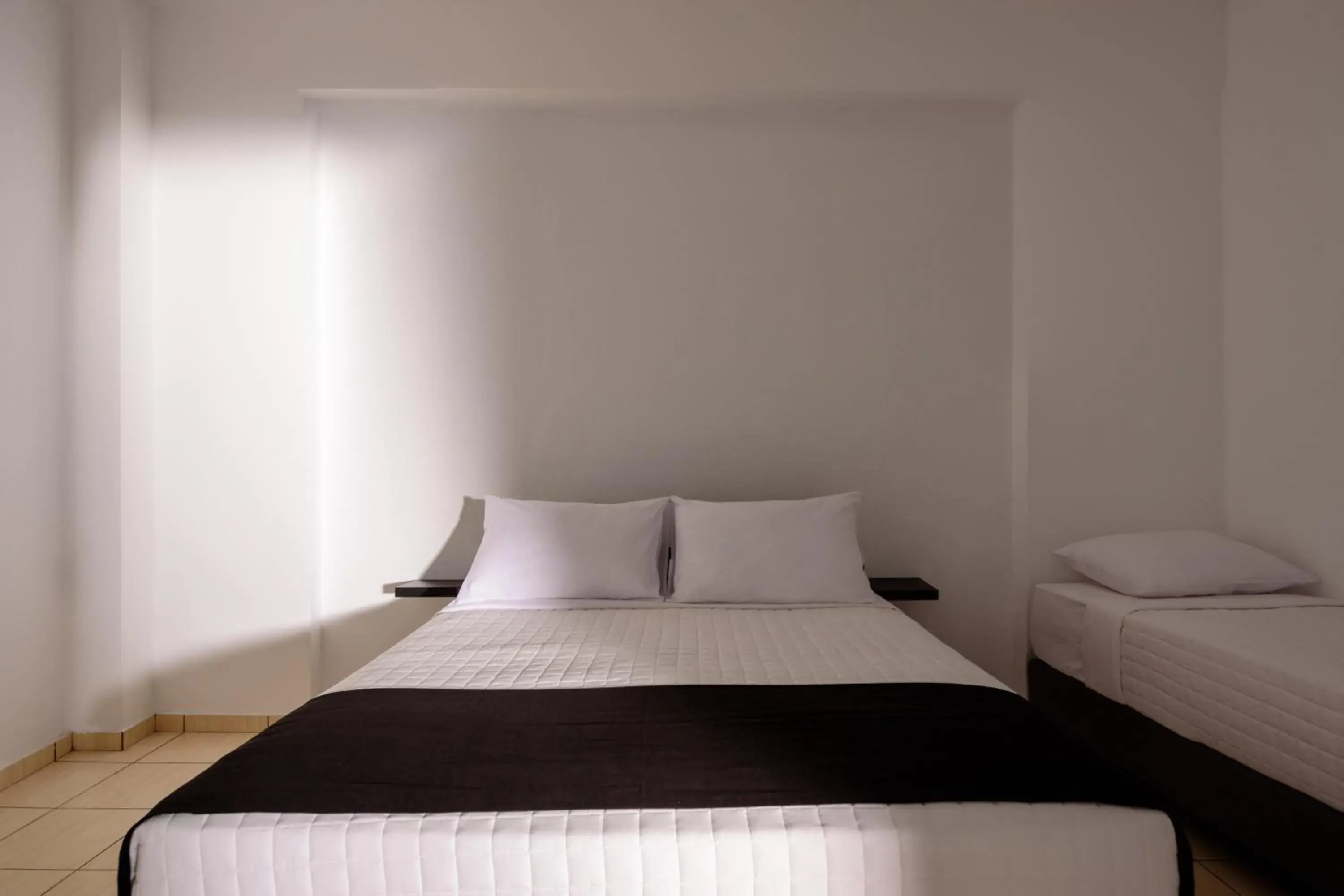 Quadruple Room with Garden View in Tataki Family Hotel Quadruple Room with Garden View in Tataki Family Hotel