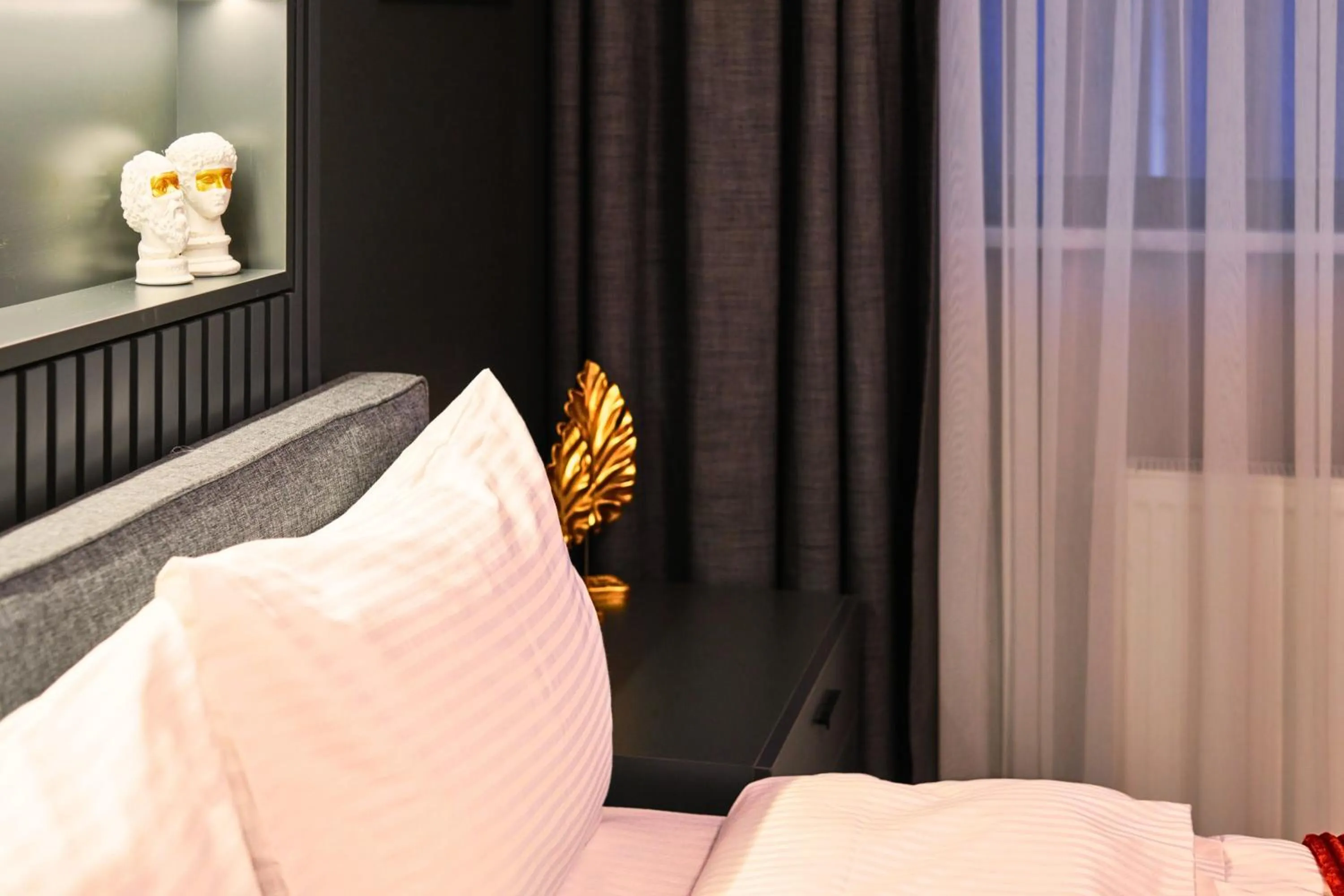 Bed in TAKS-INN Hotel