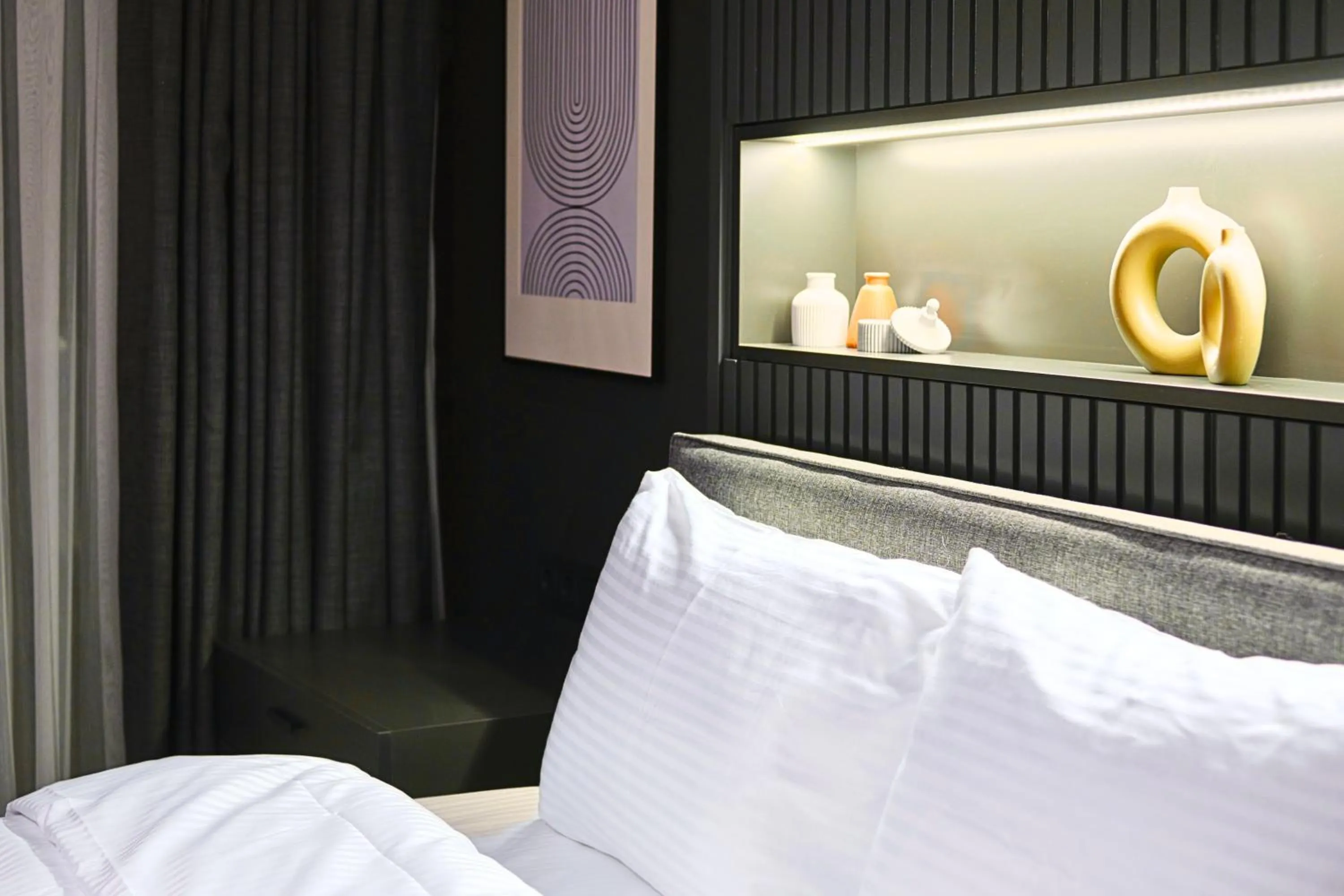 Bed in TAKS-INN Hotel