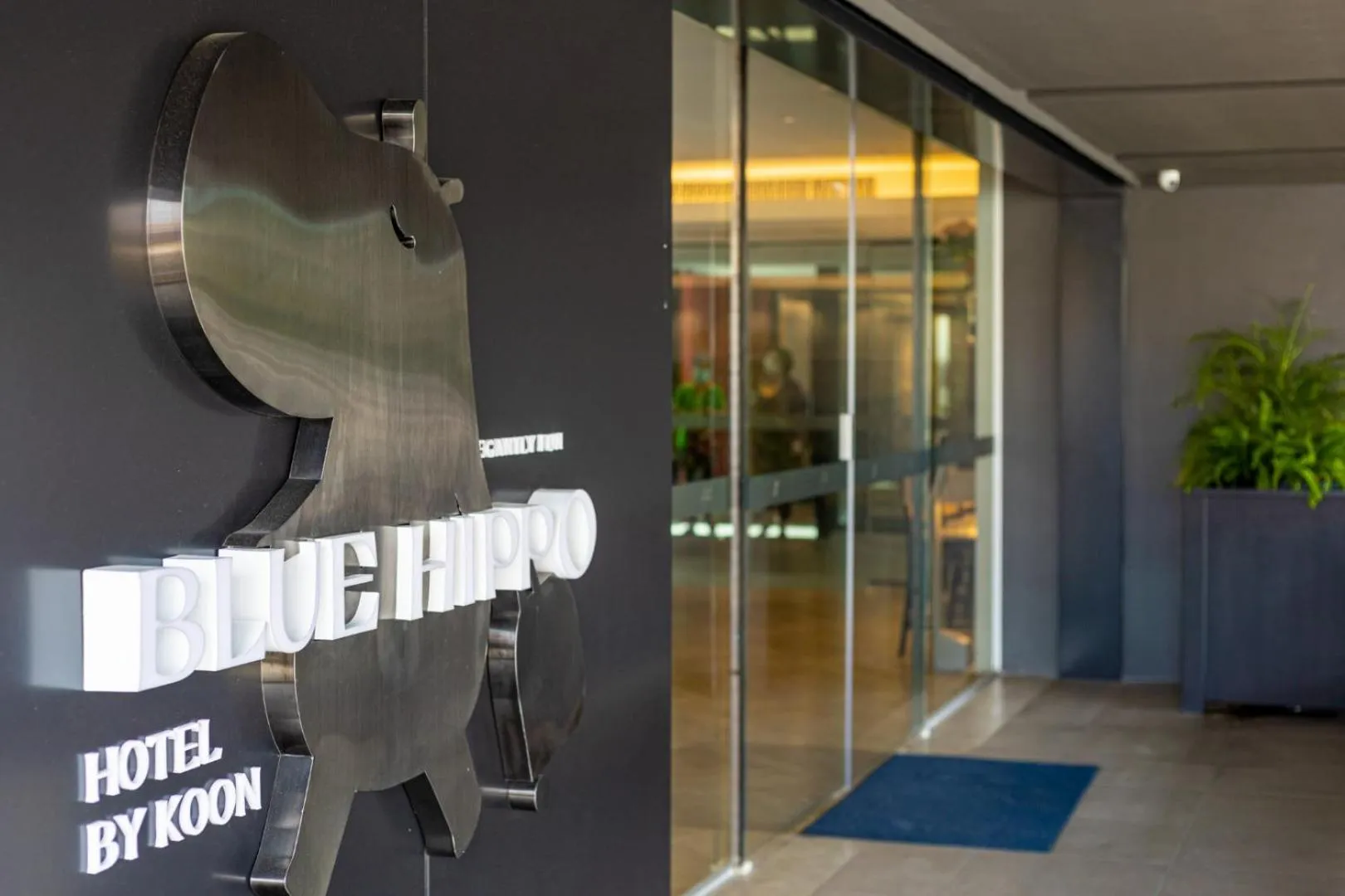 Text overlay in Blue Hippo & Red Crocodile Hotel