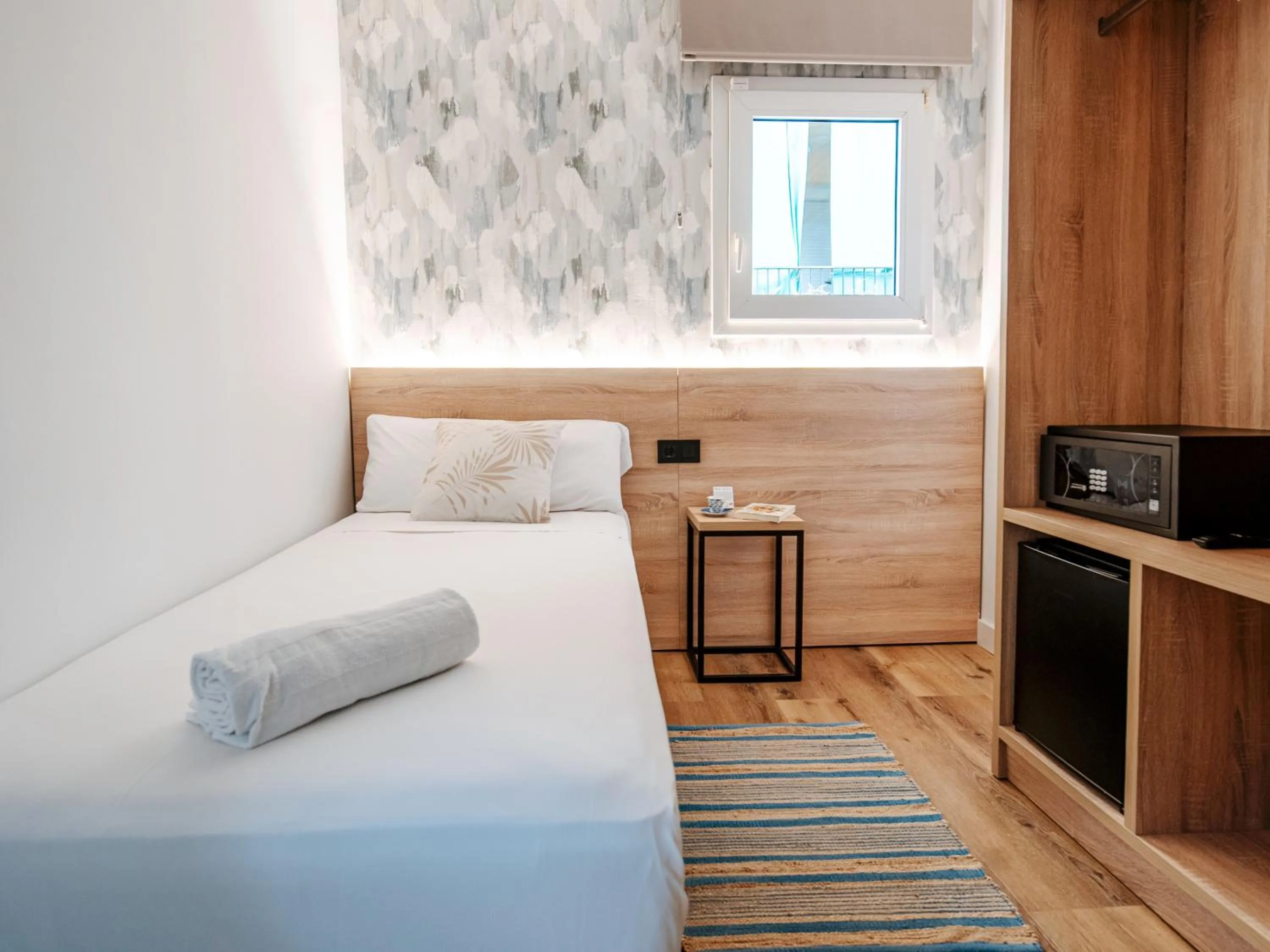 Bed in Sweet Lloret Suites