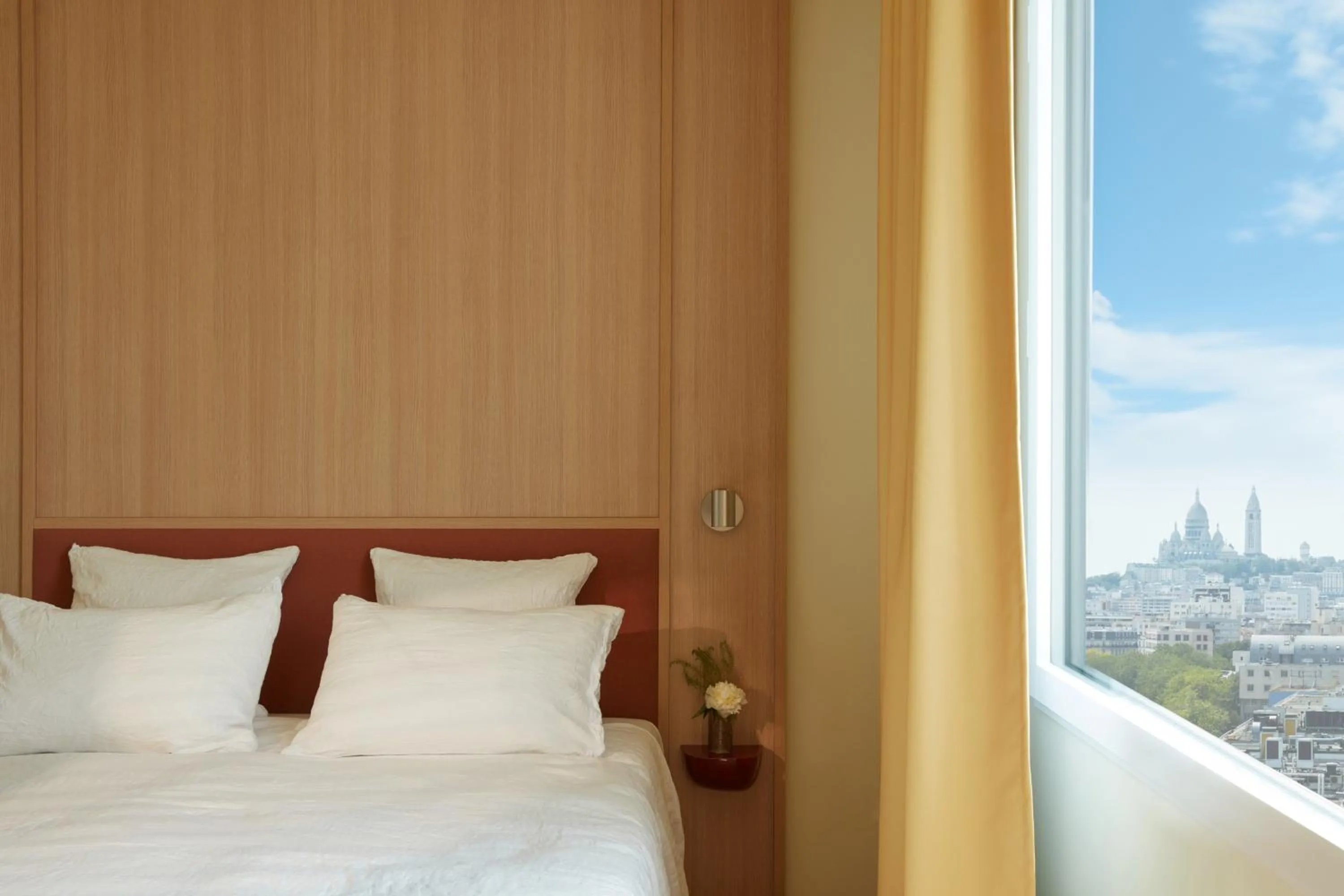 Landmark view, Bed in OKKO Hotels Paris Rosa Parks