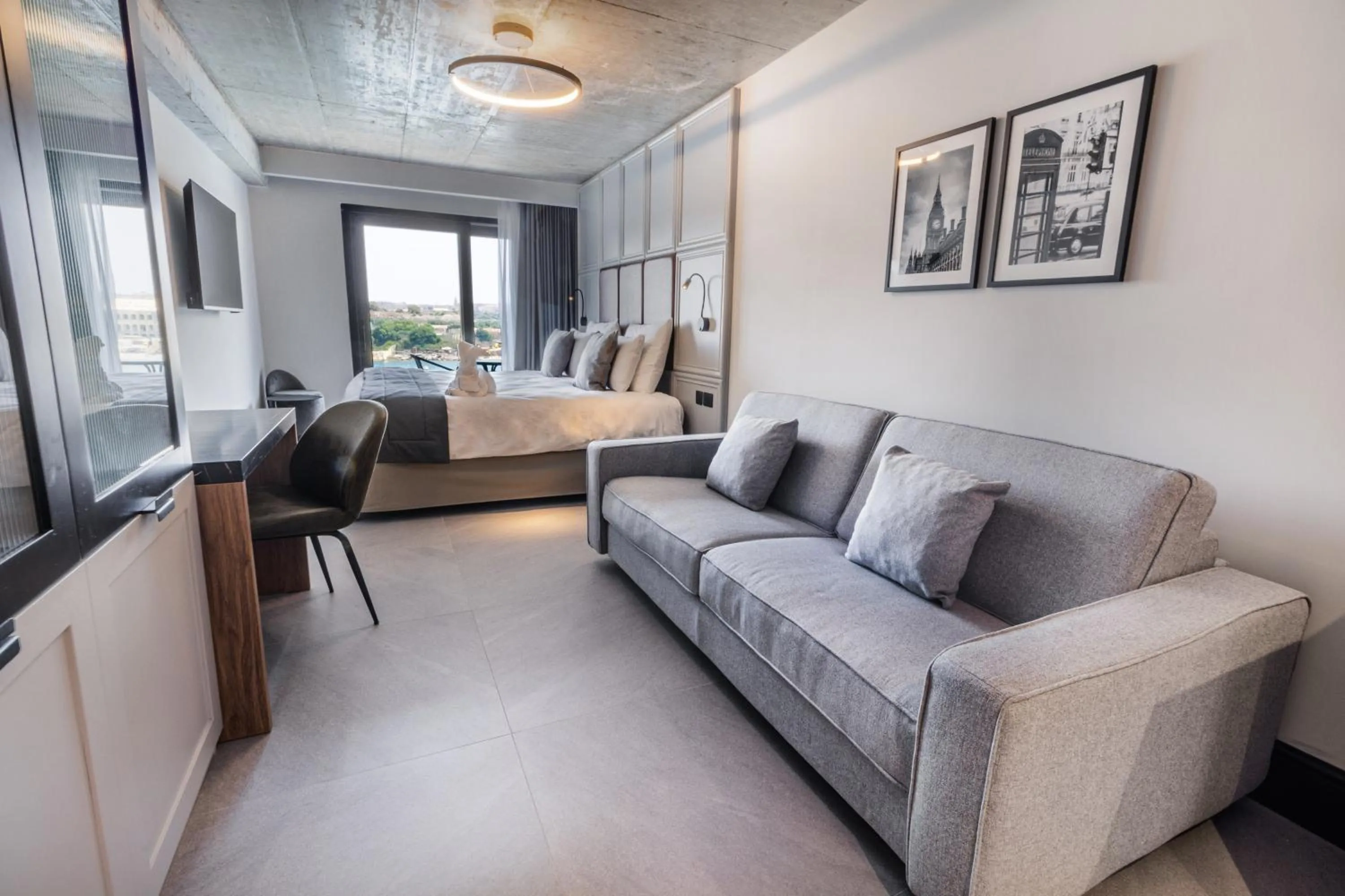 Seating area, Bed in The Londoner Hotel Sliema